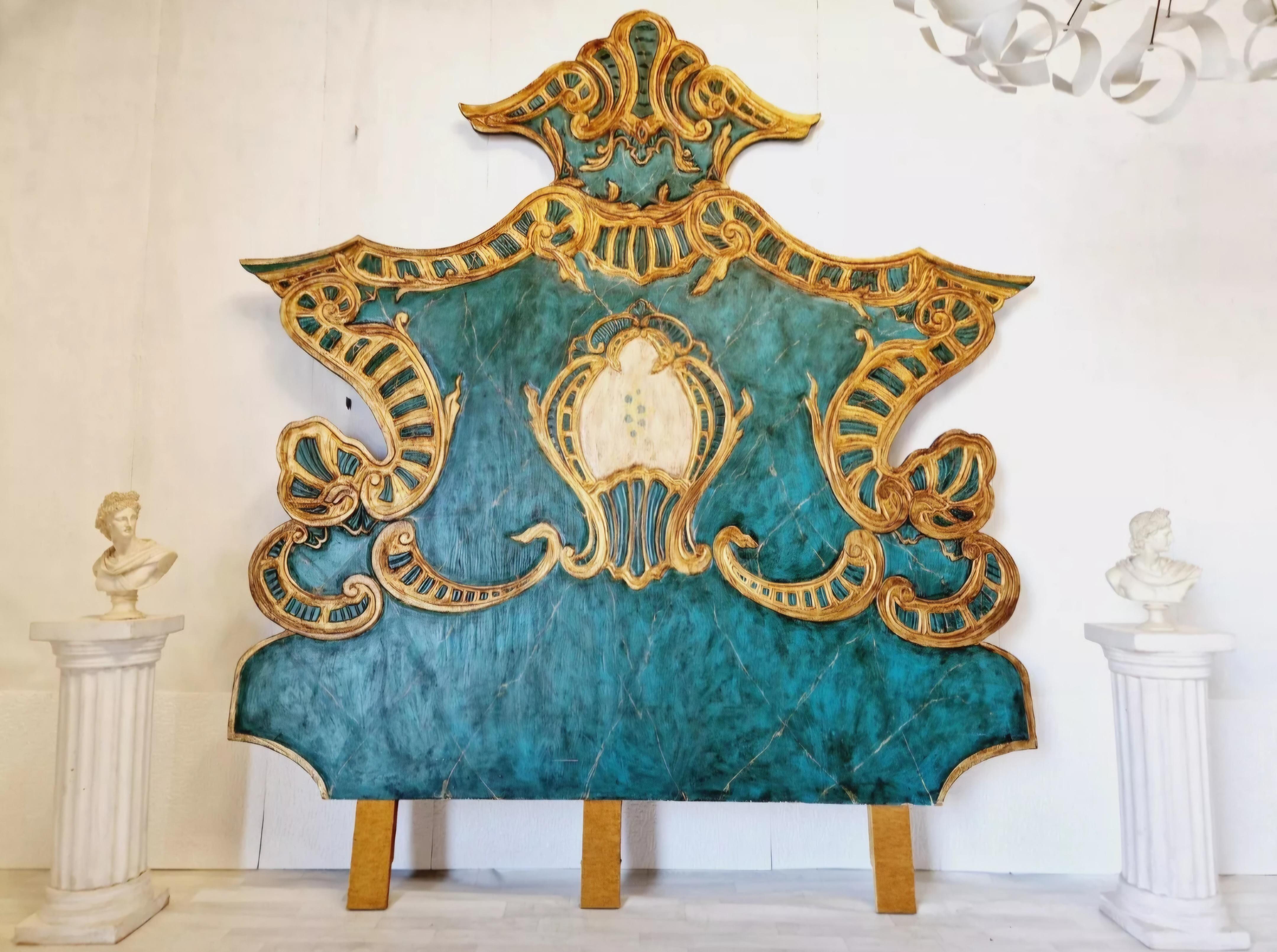 
Add a touch of vintage elegance to your bedroom with this stunning Venetian Peacock style headboard. Crafted from wood, compressed wood and finished with a gorgeous Turquoise lacquer, this huge headboard features intricate carvings that add a touch