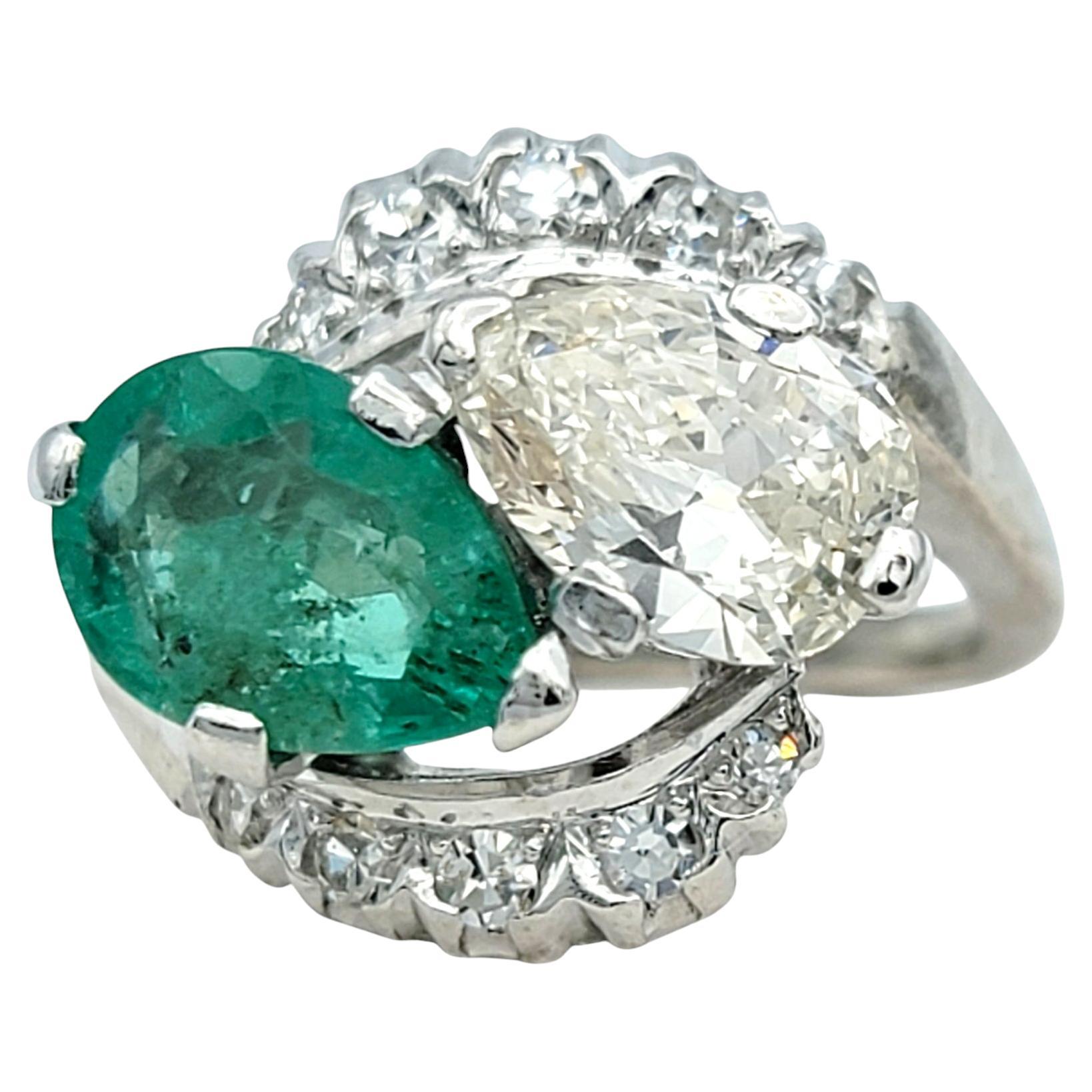 Ring Size: 3.25

Experience the breathtaking allure of Old World craftsmanship with this exquisite vintage emerald and diamond ring. Centered by a vivid green pear-shaped emerald, this natural beryl gemstone radiates timeless elegance and embodies