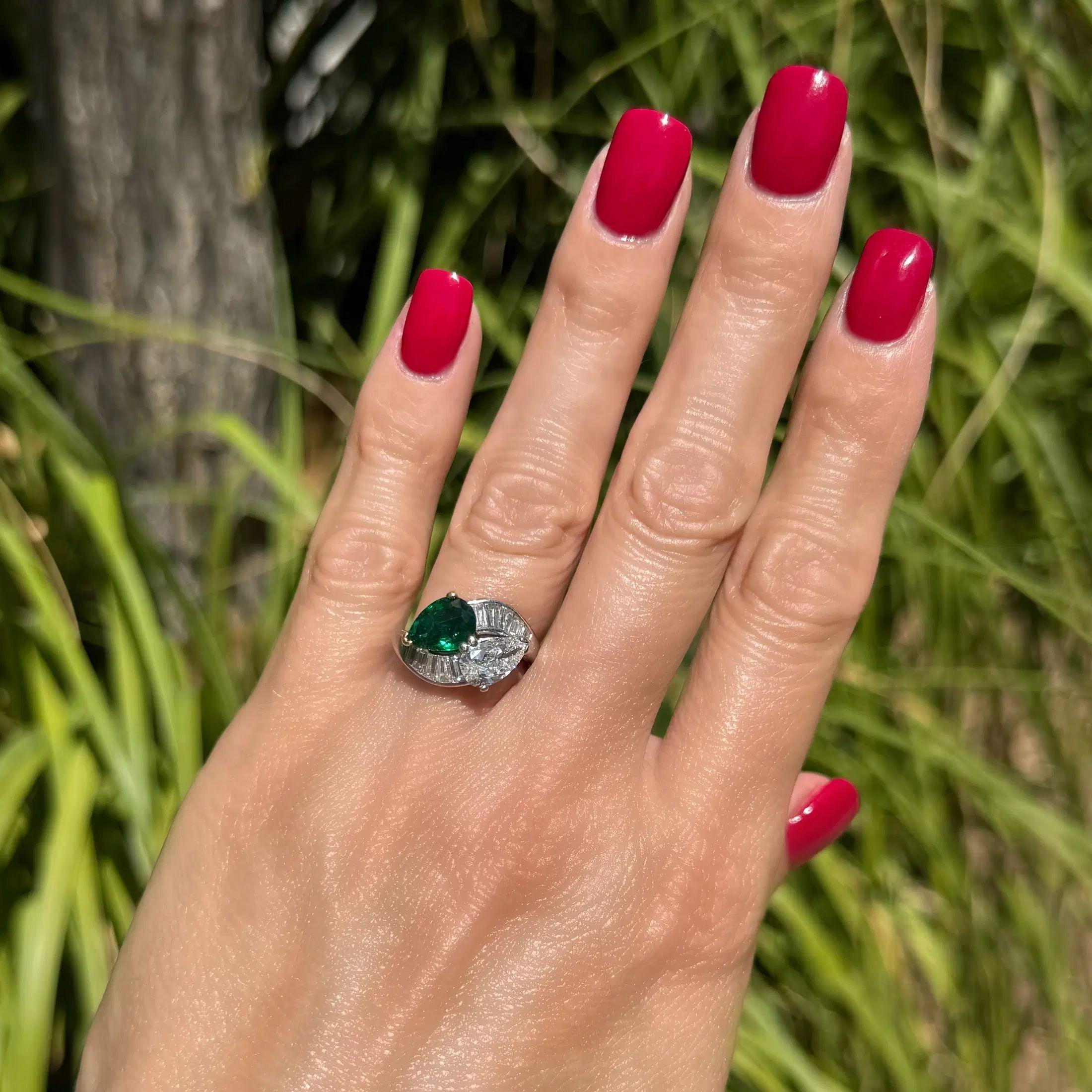 Modernist Vintage Pear Diamond, Emerald and Baguette Diamond Platinum Bypass Ring For Sale