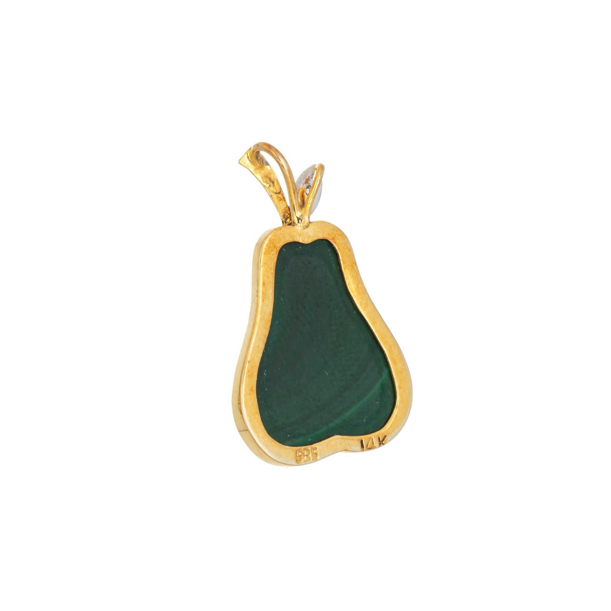 Finely detailed Pear pendant crafted in 14 karat yellow gold (circa 1960s to 1970s). 

Malachite measures 20mm x 12mm. The malachite is in very good condition and free of cracks or chips. One small single cut diamond is estimated at 0.01 carats