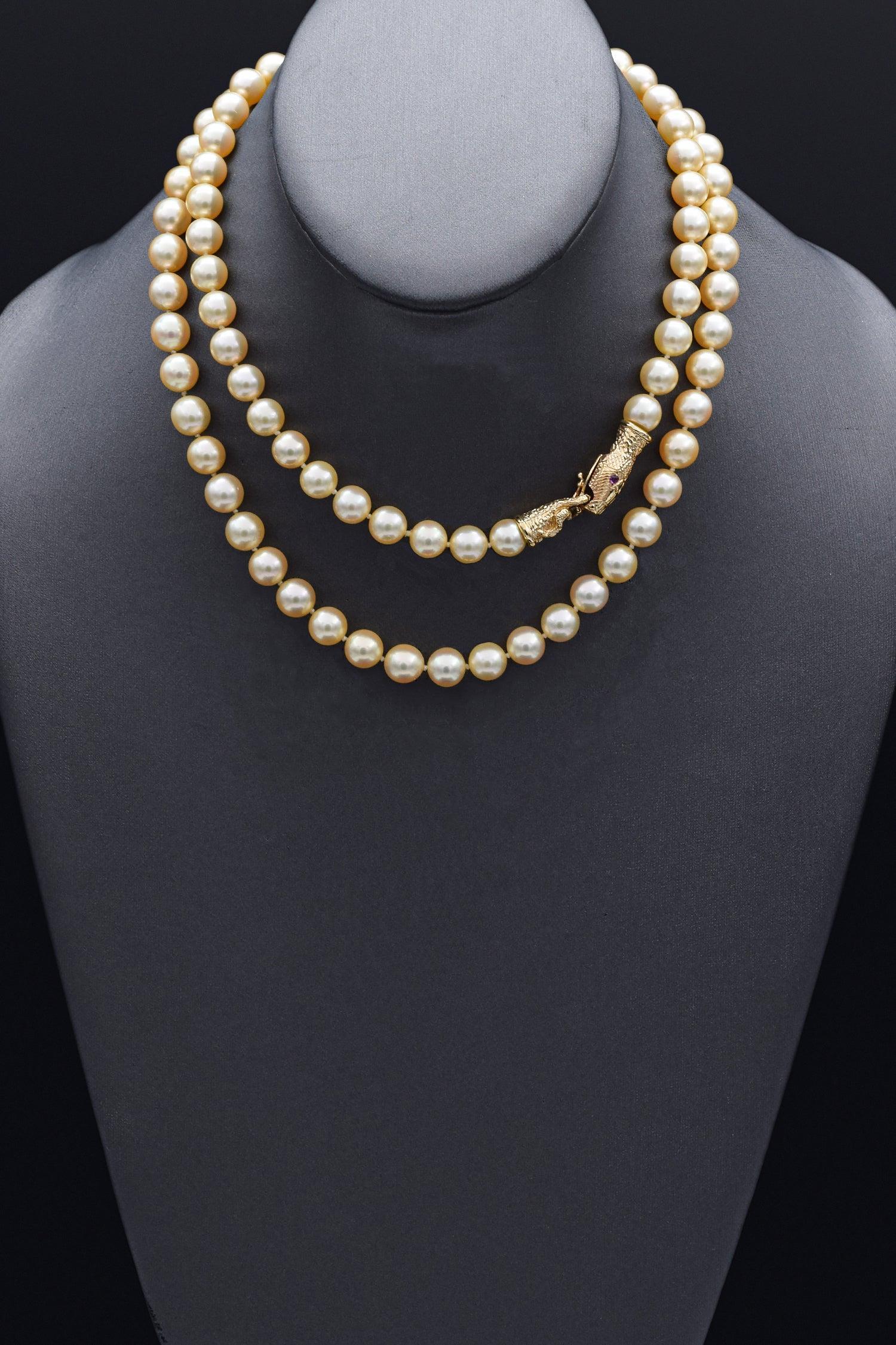 Vintage Pearl 14k Yellow Gold with Ruby Eyes Snake Clasp Beaded Strand Necklace In Good Condition For Sale In New York, NY