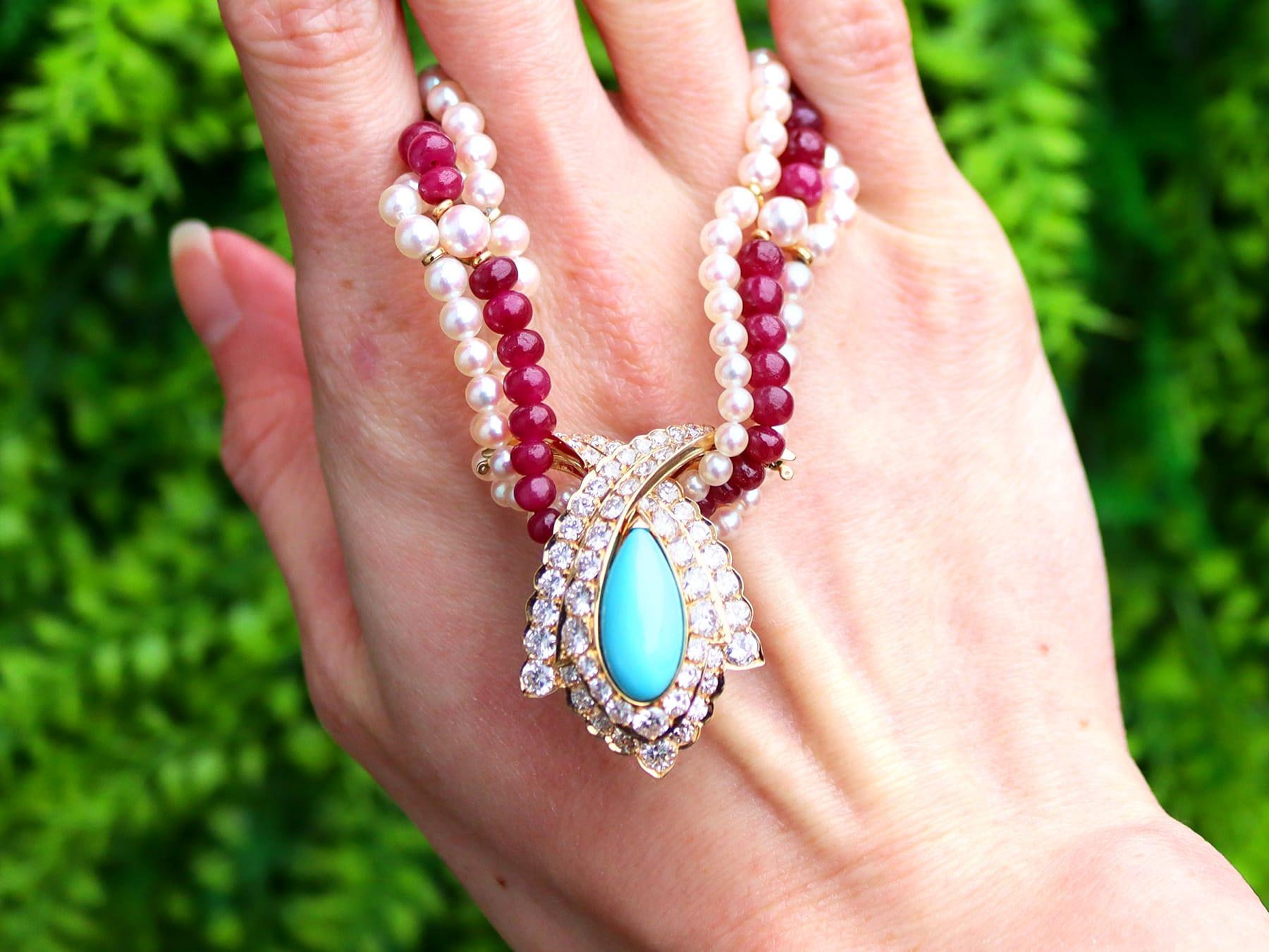 A stunning, fine and impressive vintage double strand pearl and single strand 23 carat ruby necklace with a 4.20 carat turquoise and 3.38 carat diamond, 18 karat yellow gold clasp; part of our diverse jewellery and estate jewelry collections

This