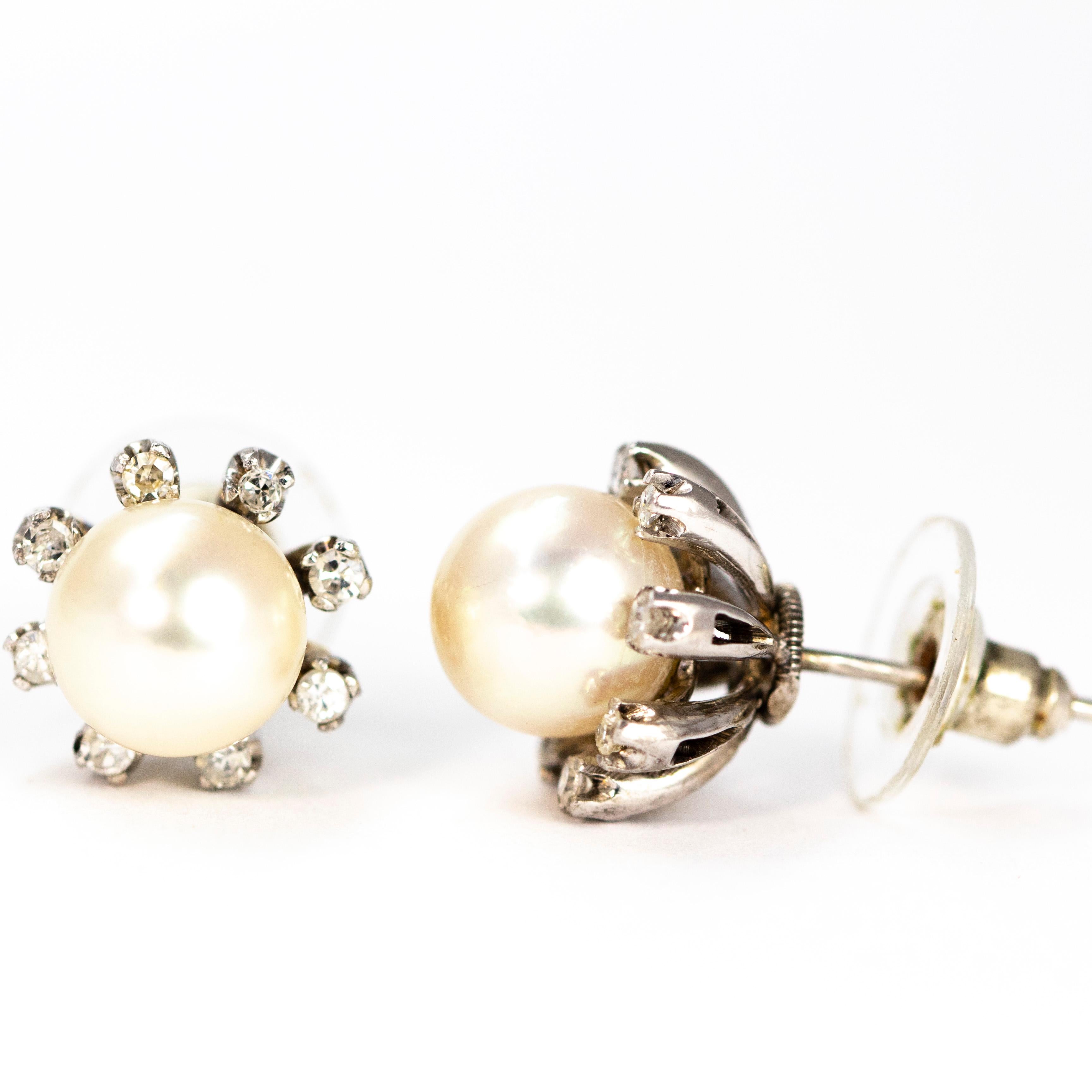 These stunning shimmering giant pearls are perched upon and surrounded by single diamonds each singularly set. The earrings are modelled in 14ct white gold which complements the pearl and diamonds perfectly.

Diameter: 13mm

