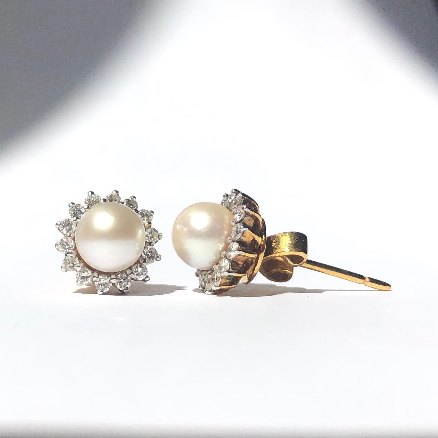 This pair of classic and gorgeous pearl cluster earrings hold a total of 30pts of diamonds. The pearls are bright and glossy and the diamonds add the perfect mount of sparkle. 

Cluster Diameter: 9mm 

Weight: 3.8g