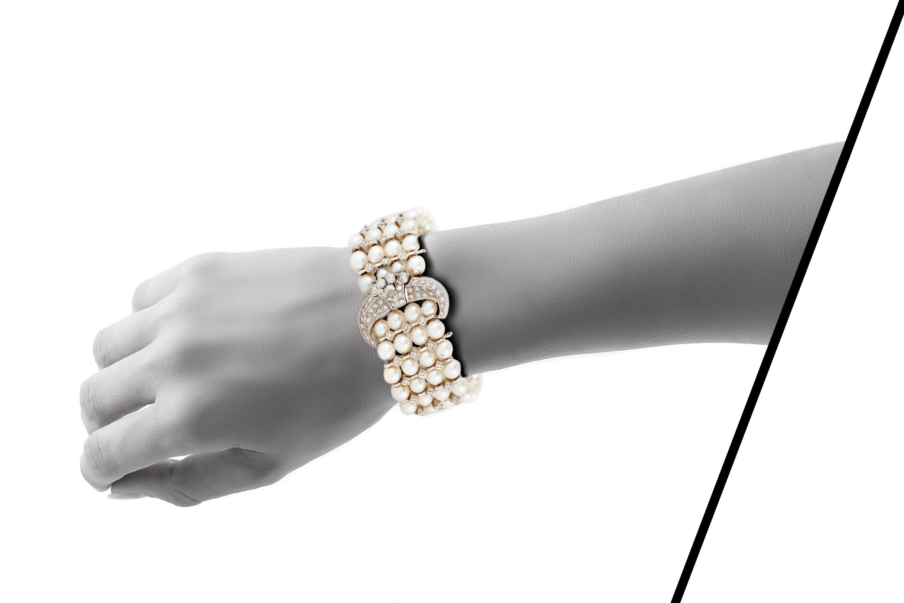Vintage pearl and diamonds bracelet, featuring four strands of cultured pearls with buckle clasp and dividing bars, finely crafted in platinum with single cut diamonds, weighing a total of approximately 4.50 carats.

Circa 1950's