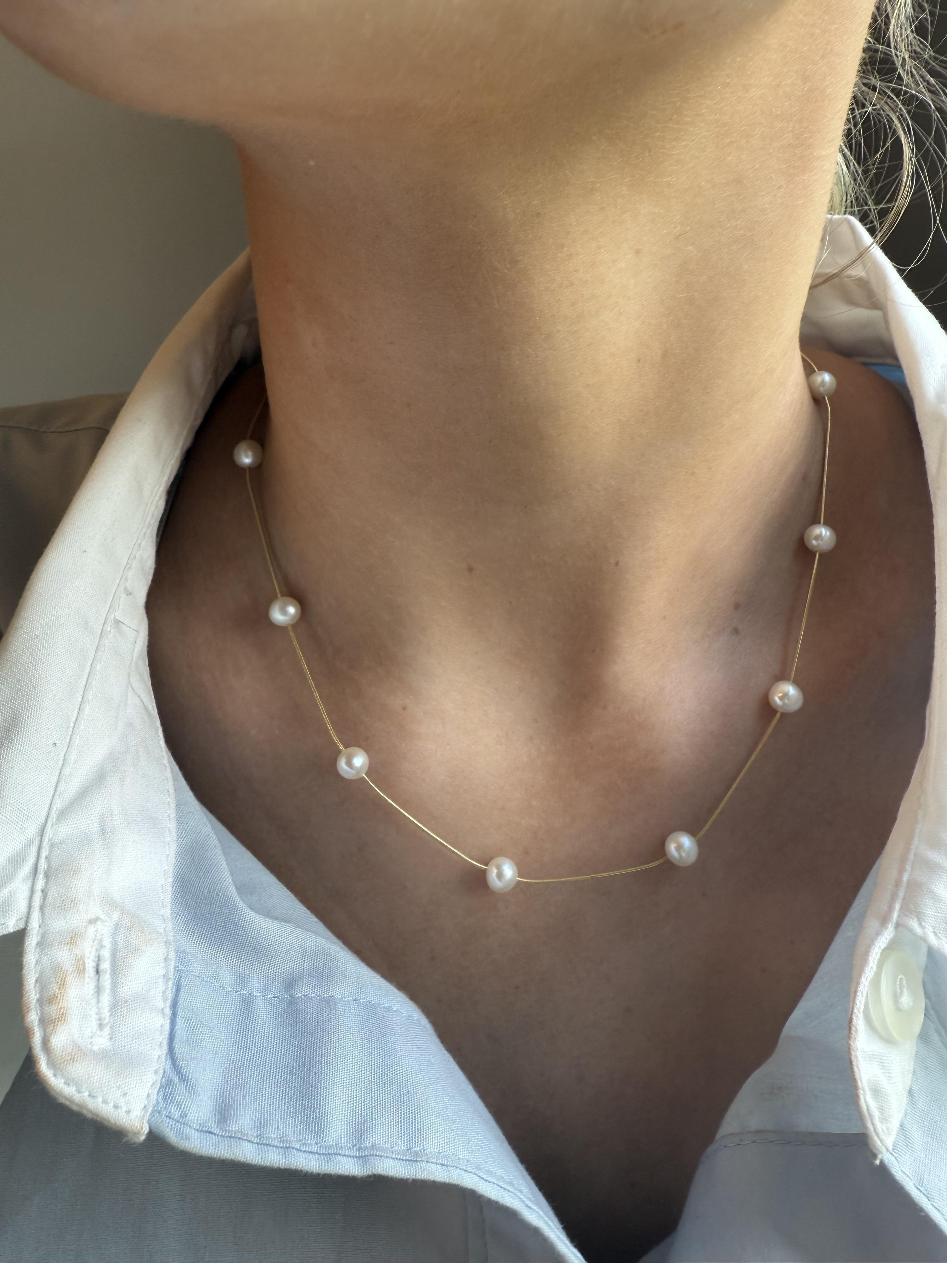 We are loving the simple yet unique take on a pearl necklace!!

Necklace Details
Material: 14K Yellow Gold
Length: 16 Inches
Weight: 4.9 Grams

Accented by the following gemstones
11 - 5.8mm Semi Round Cultured Pearl Gemstones

Item: 768TMV8-AMQ