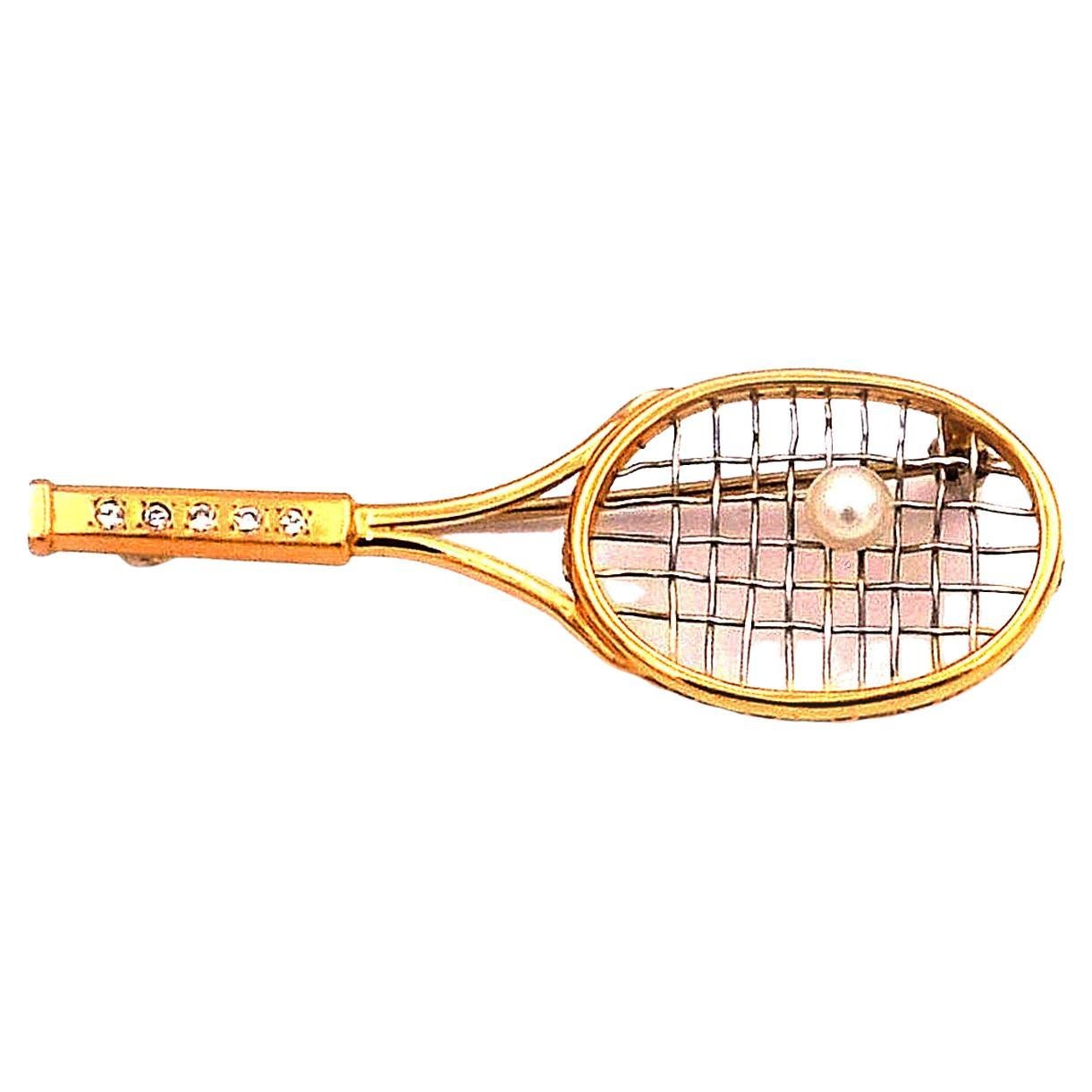 Vintage Pearl Diamond 18K Gold and Platinum Tennis Racket Brooch 

Game - Set - Match!  This decorative gold brooch is made of yellow gold in the shape of a tennis racket, the handle set with five radiant diamonds totalling 0.05 ct, the striking