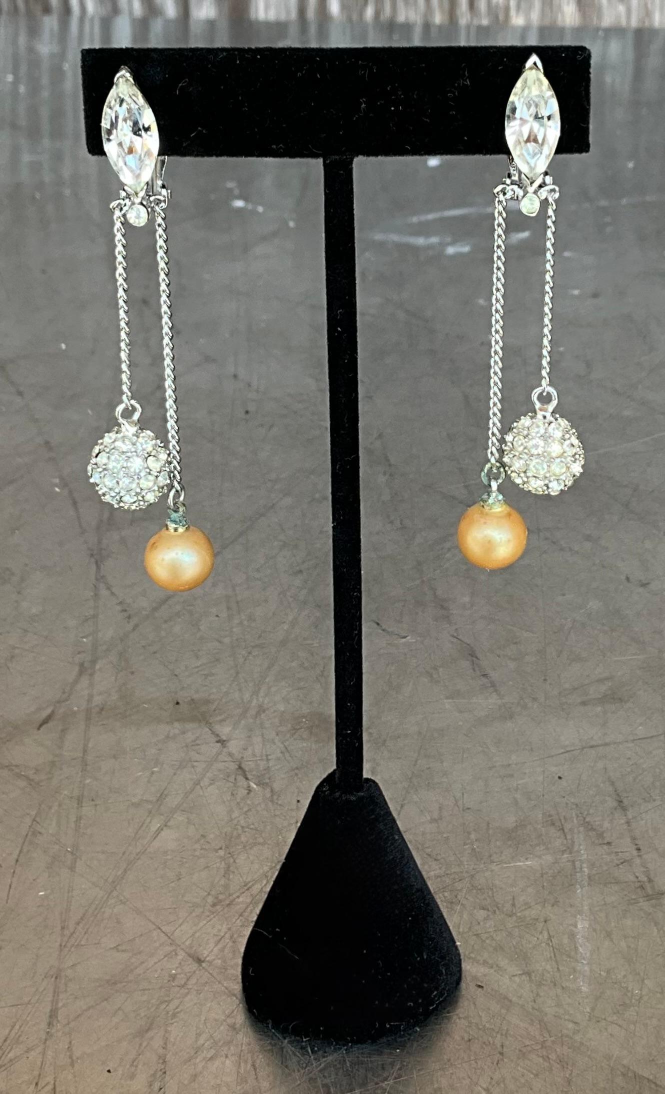 Vintage pearl drop clip-on earrings are timeless, elegant pieces that can elevate any outfit, offering a graceful blend of sophistication and classic style. The combination of pearls and drop earring designs evokes a sense of refinement, making them