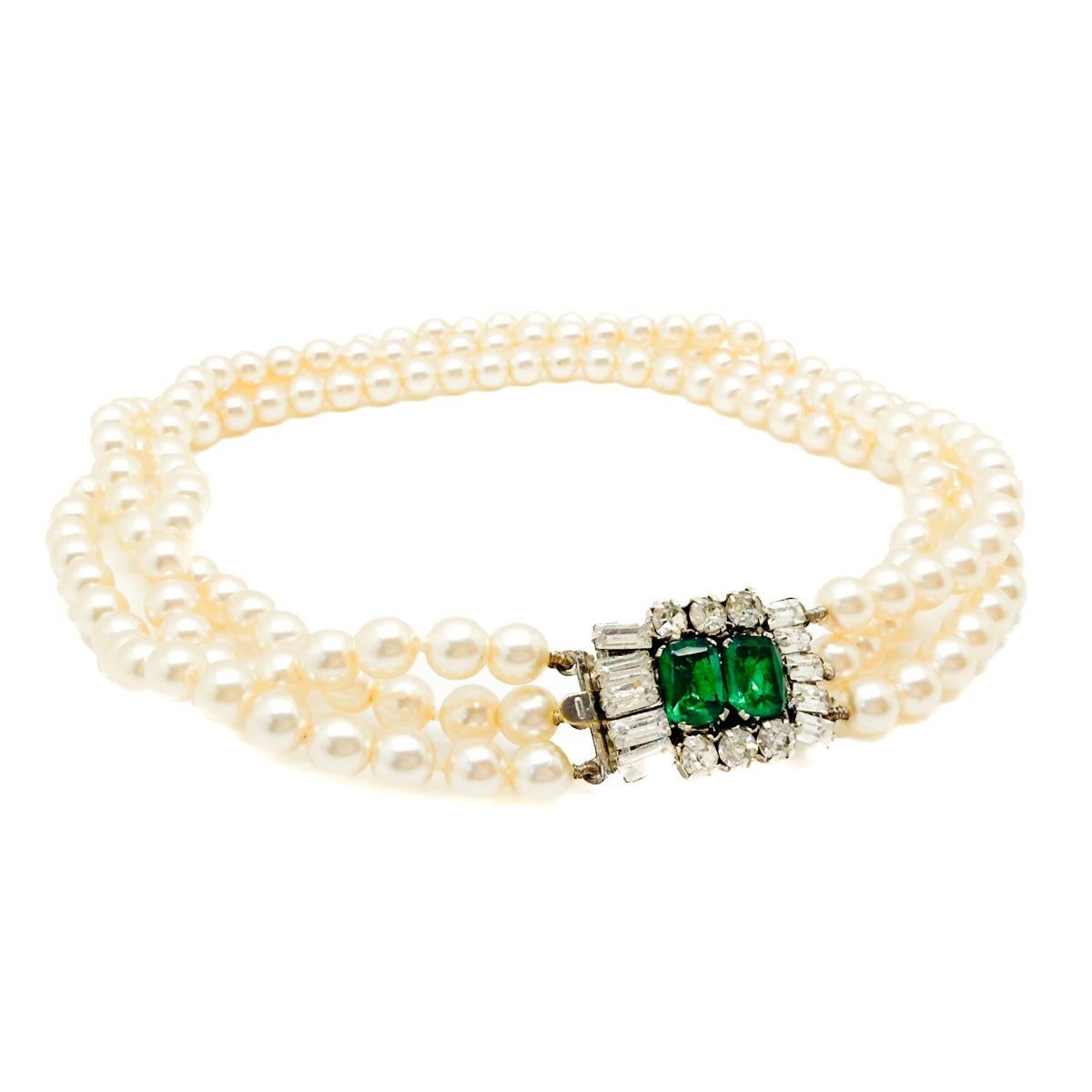 A Vintage Pearl & Emerald Paste Choker. Demure and daring and undoubtedly eternally elegant.
An unsigned beauty. A rare treasure. Just because a jewel doesn’t carry a designer name, doesn’t mean it isn't coveted. The unsigned beauties in our