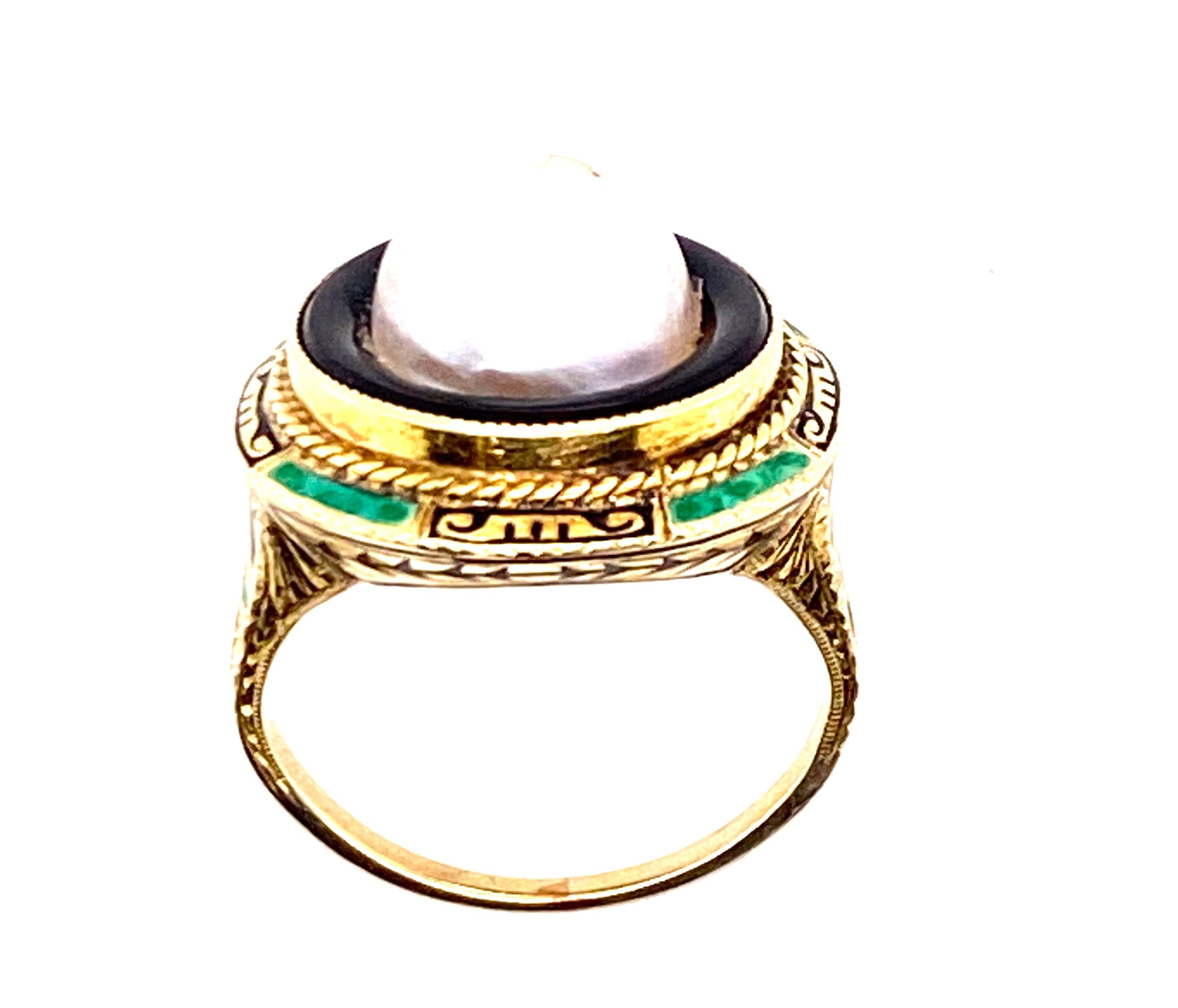 Genuine Original Art Deco Antique from 1920's Pearl Enamel 14K Yellow Gold Cocktail Ring


Features a 9mm Natural Round Pearl Center

Hand Painted Enamel In Outstanding Condition

Pearl is Encircled by an Onyx Gemstone

Hand Carved