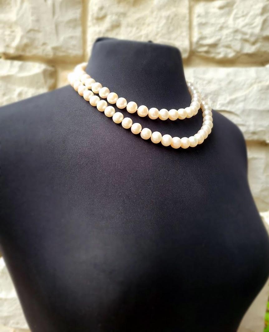 Finished with a sterling silver clasp with genuine freshwater pearls are lustrous Freshwater cultured pearls, double knotted in two rows on white silk. This 18.5-inch double-strand Freshwater pearl necklace is perfect for infusing a touch of