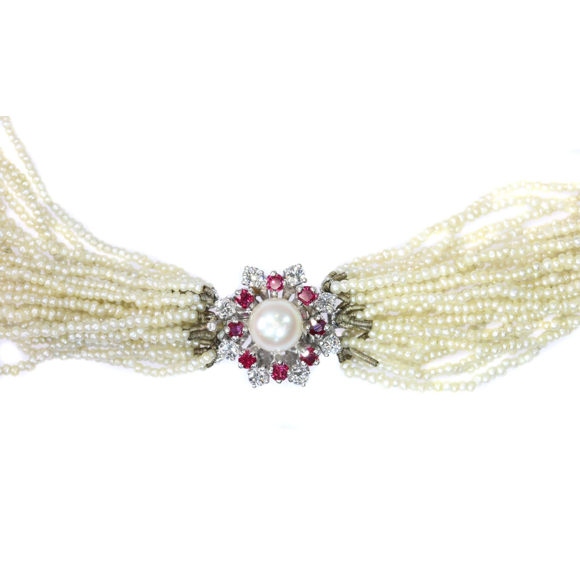 Although the closure of this necklace is made somewhere in the Fifties, the 24 strings of seed pearls are most probably much older. We think they can be as old as the second half of the 19th Century. As is still the case today, it was not uncommon