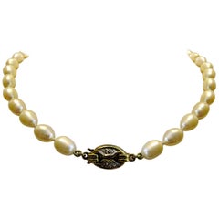 Vintage Pearl Necklace with 14 Karat Gold and Diamond Brooch