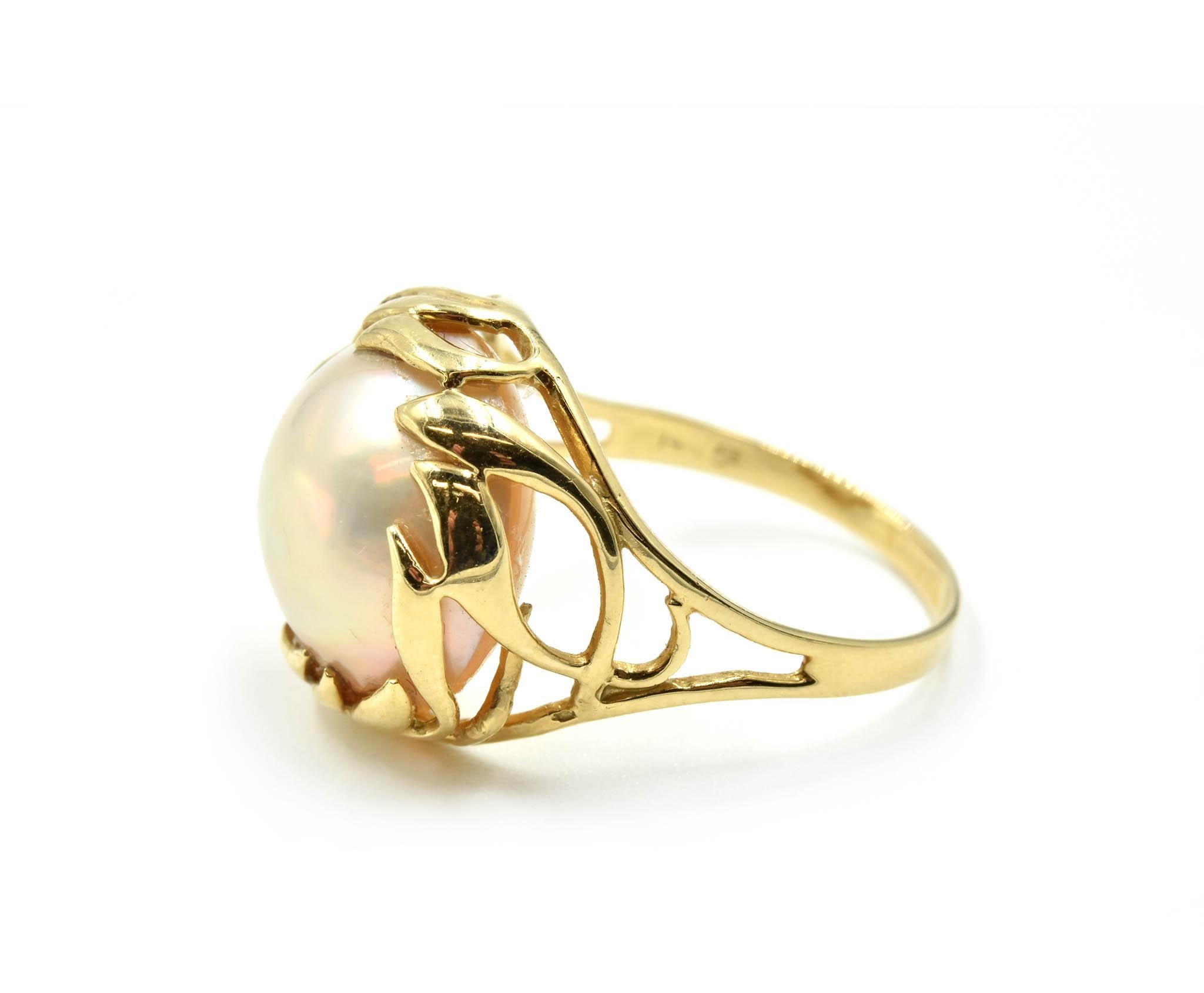 Designer: custom design
Material: 14k yellow gold
Dimensions: ring top is a 1/2-inch in diameter
Ring Size: 6 1/2 (please allow two extra shipping days for sizing requests) 
Weight: 3.70 grams
