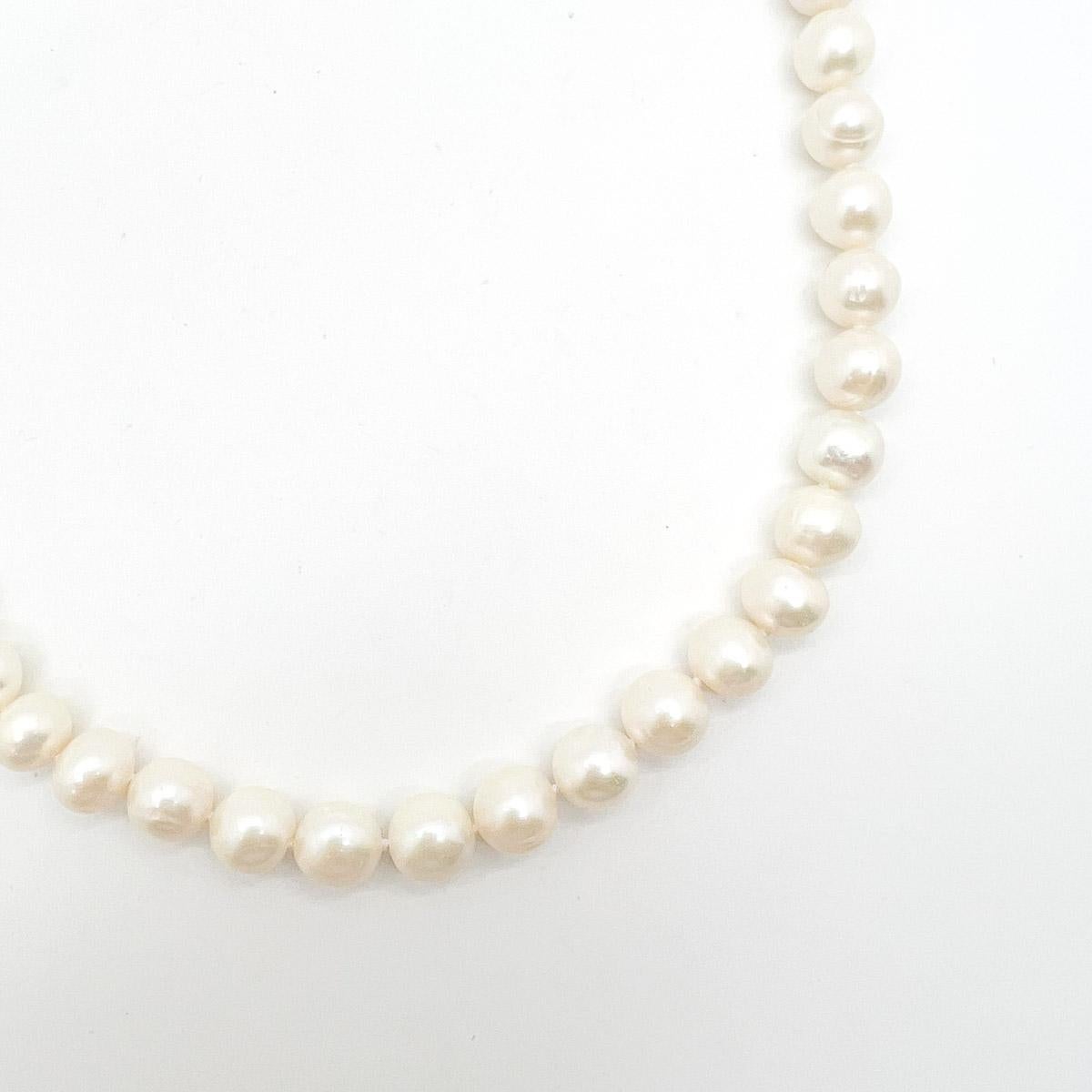 A Vintage Pearl Rope Necklace. A quintessential vintage pearl rope necklace. Elegant and lustrous non-graduated freshwater pearls form a short length rope. Finished with a filigree clasp. Forever in style layered or alone. The ultimate go to