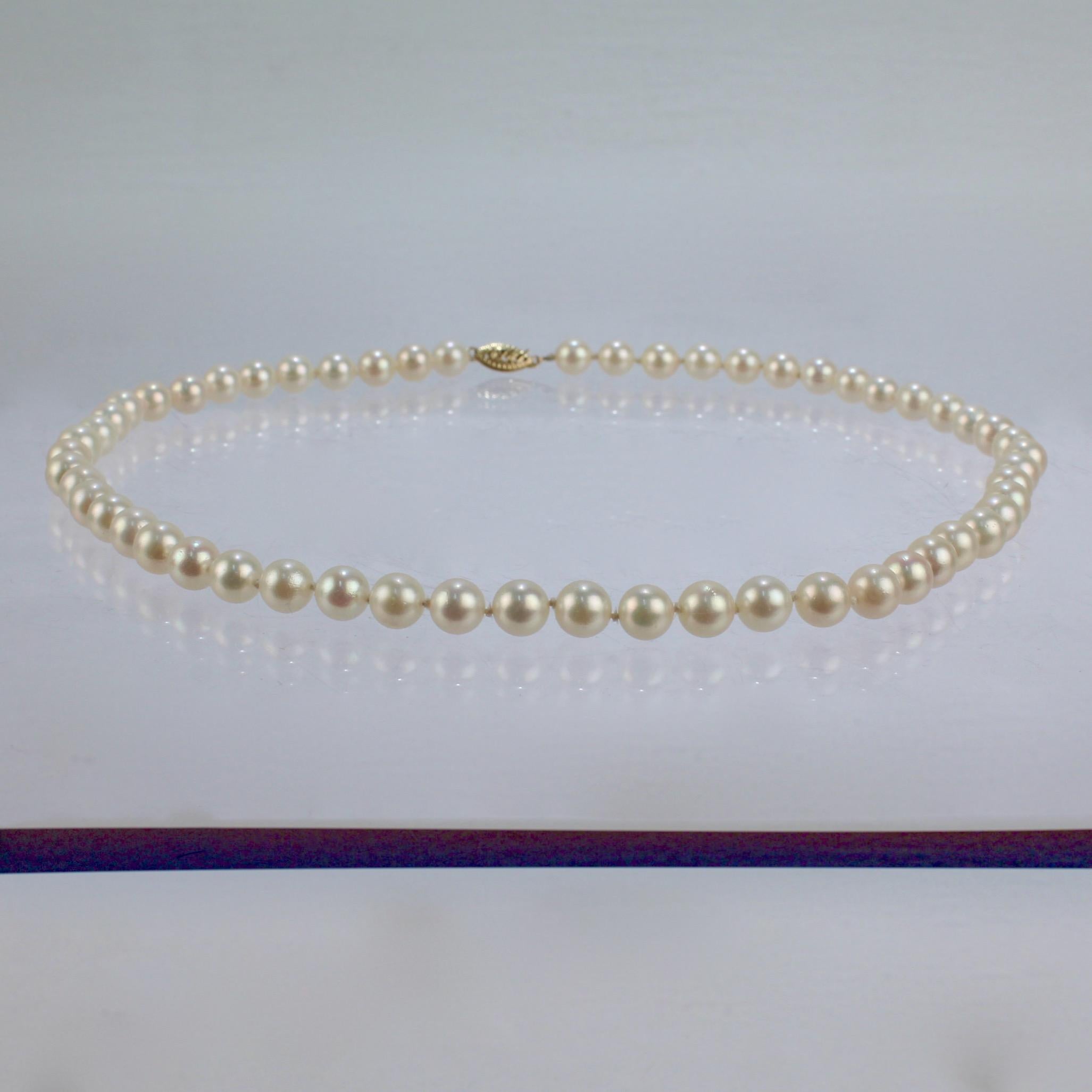 A very fine pearl strand of cultured pearls & 14k gold clasp.

With round white pearls hand-knotted on silk cord and secured with a decorative gold clasp.

Simply classic style!

Date:
20th Century

Overall Condition:
It is in overall good,