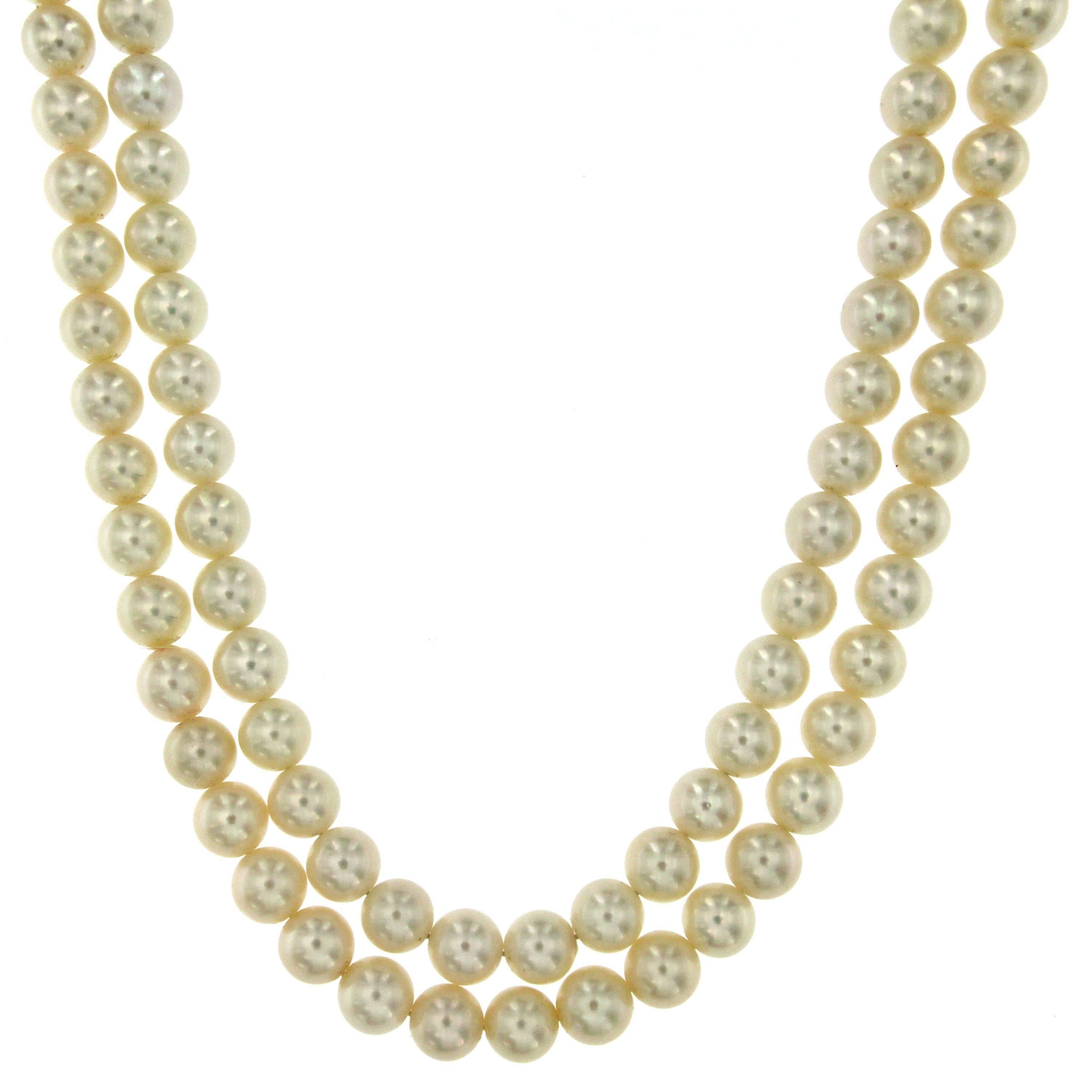 This beautifully crafted pearl necklace features great quality Japanese white pearls 8,5 mm. with a precious 18k white gold flower clasp, set with colorless diamonds (F color vvs) weight 1.20 carat and fine Sapphires in the center 2.50 ct.
The pearl
