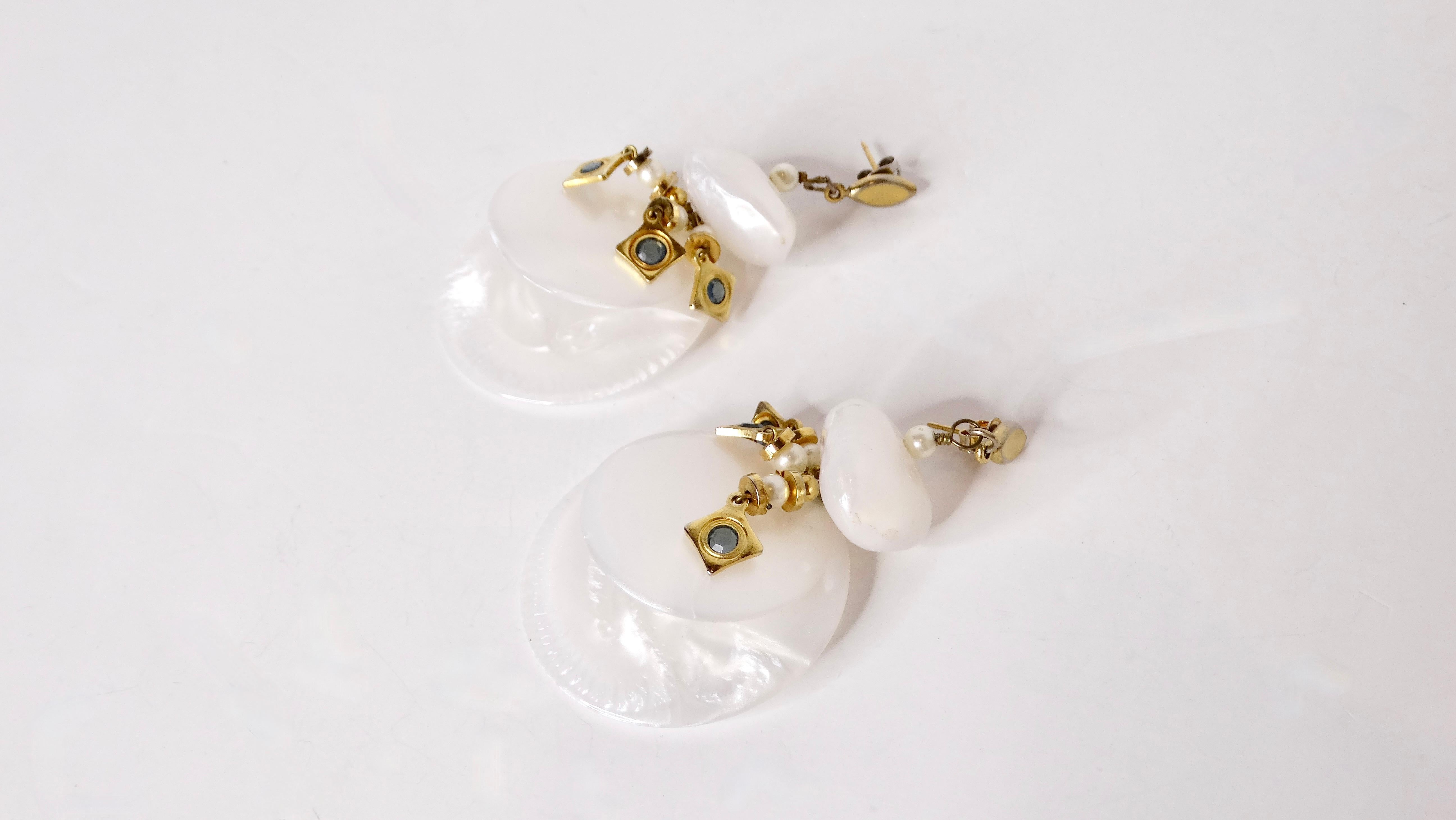 Introducing our Vintage Pearlescent Beaded Disc 14k Gold Plated Dangle Earrings, a luxurious accent that captures the essence of timeless elegance. These stunning earrings feature large, costume pearlized beaded cascading discs, delicately paired