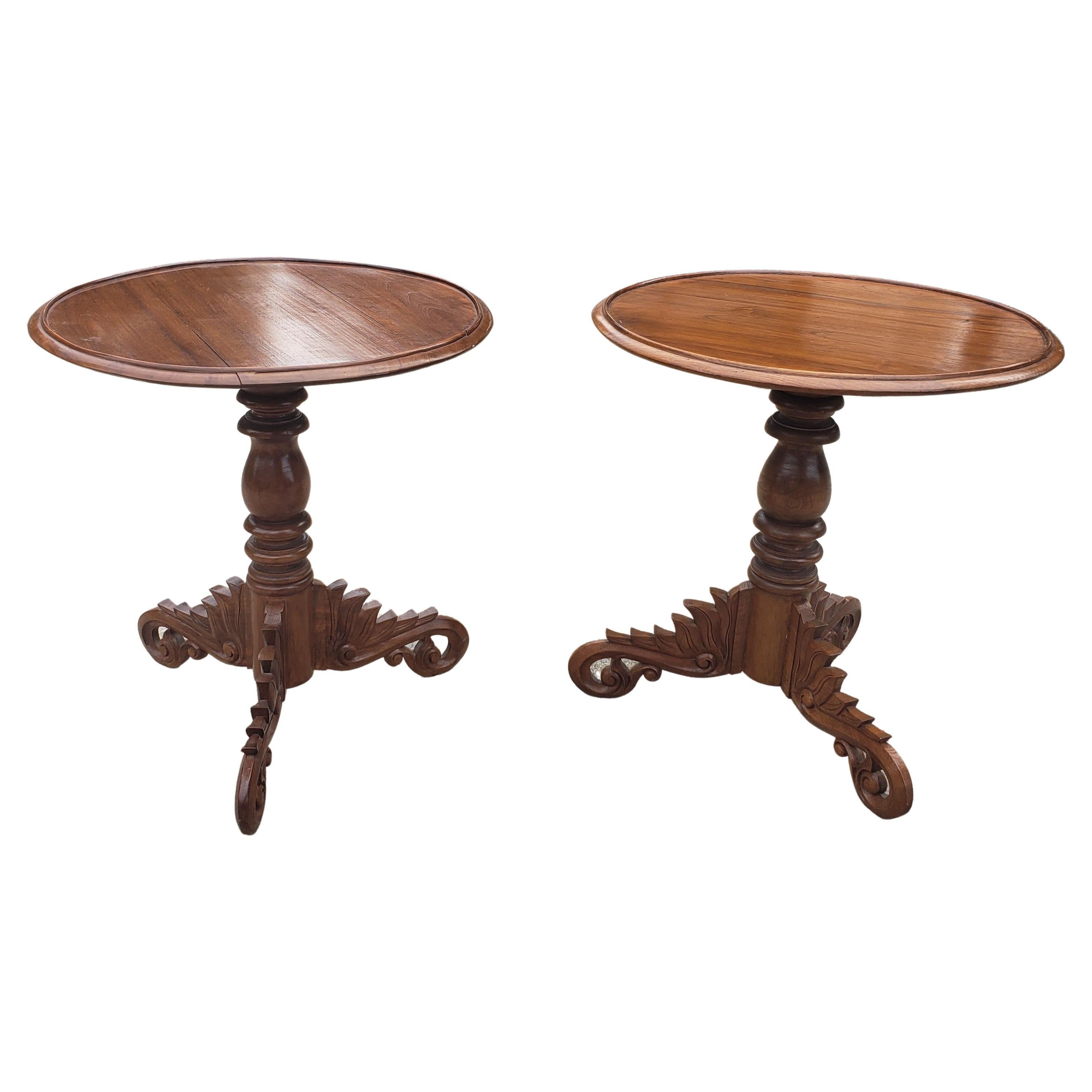 A very unique pair solid pure mahogany side tables / center tables / gueridon tables. Table is supported by a large turned pedestal on tripod alligator like sculpted feet. Tables are very stable with no wiggles at all. Measure 26 inches in diameter
