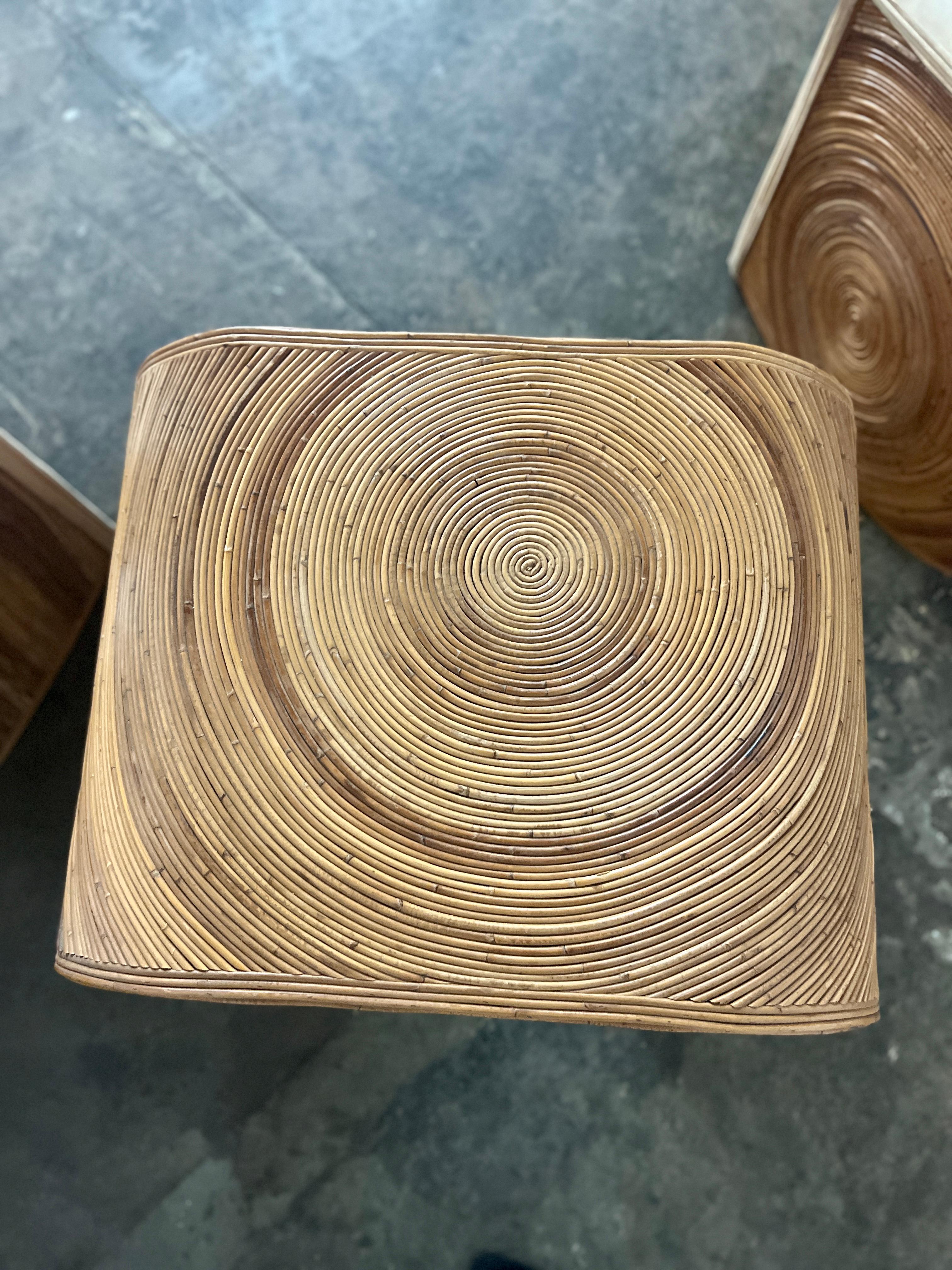 Gorgeous rattan club side chairs and a side table from the 1970s inspired by Gabriella Crespi. Great colors and patina. The patterns are so mesmerizing and you can’t take your eyes off of them. The pencil reed frame is in excellent vintage