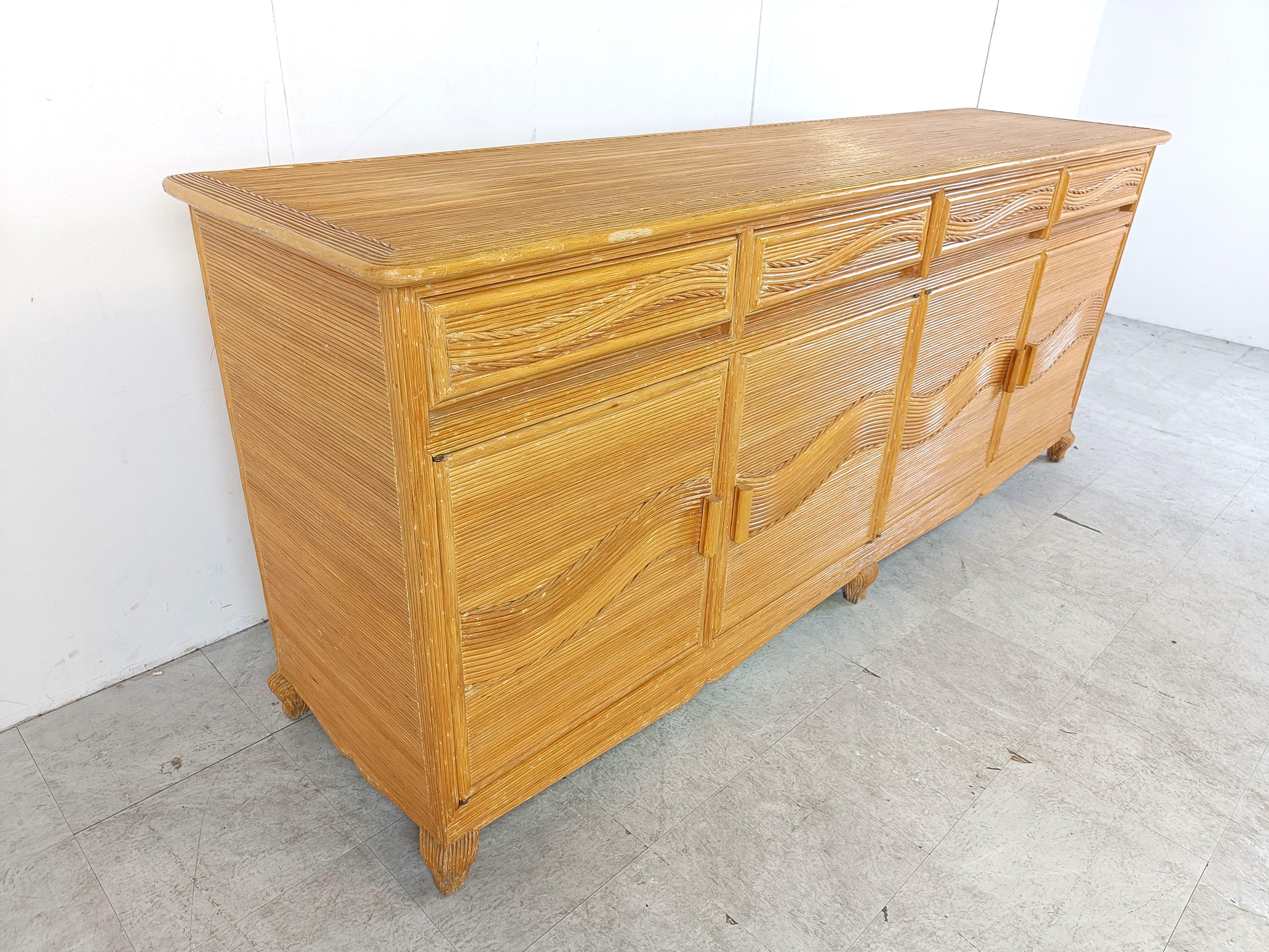 Elegant pencil reed sideboard with 4 doors and 4 drawers.

Very decorative pattern.

Good condition.

1970s - France

Dimensions:
Lenght: 220cm/76.77