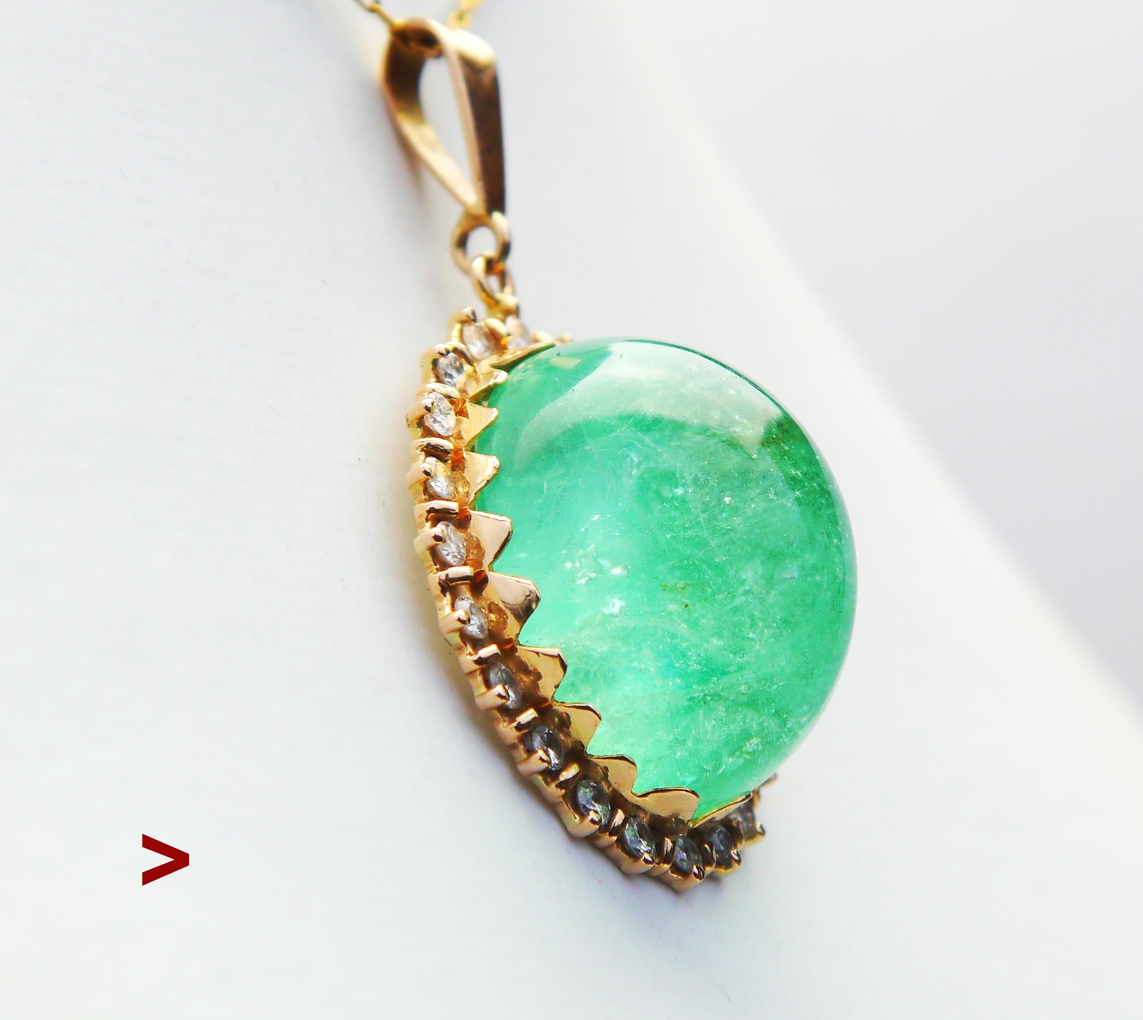 This is a very attractive golden pendant with a huge natural Emerald surrounded by Diamonds.

Emerald measures 24 mm x 20 mm x 14 mm deep / ca. 50 ct .

This stone is of Light Green variety with weak hue of blue, transparent, with multiple