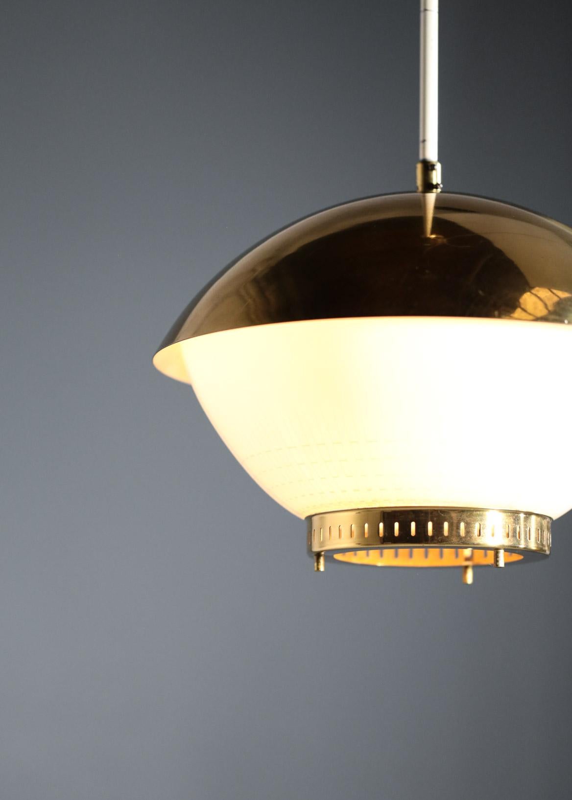 Vintage pendant by Zukov form 1950s.
In the style of Paavo Tynell.