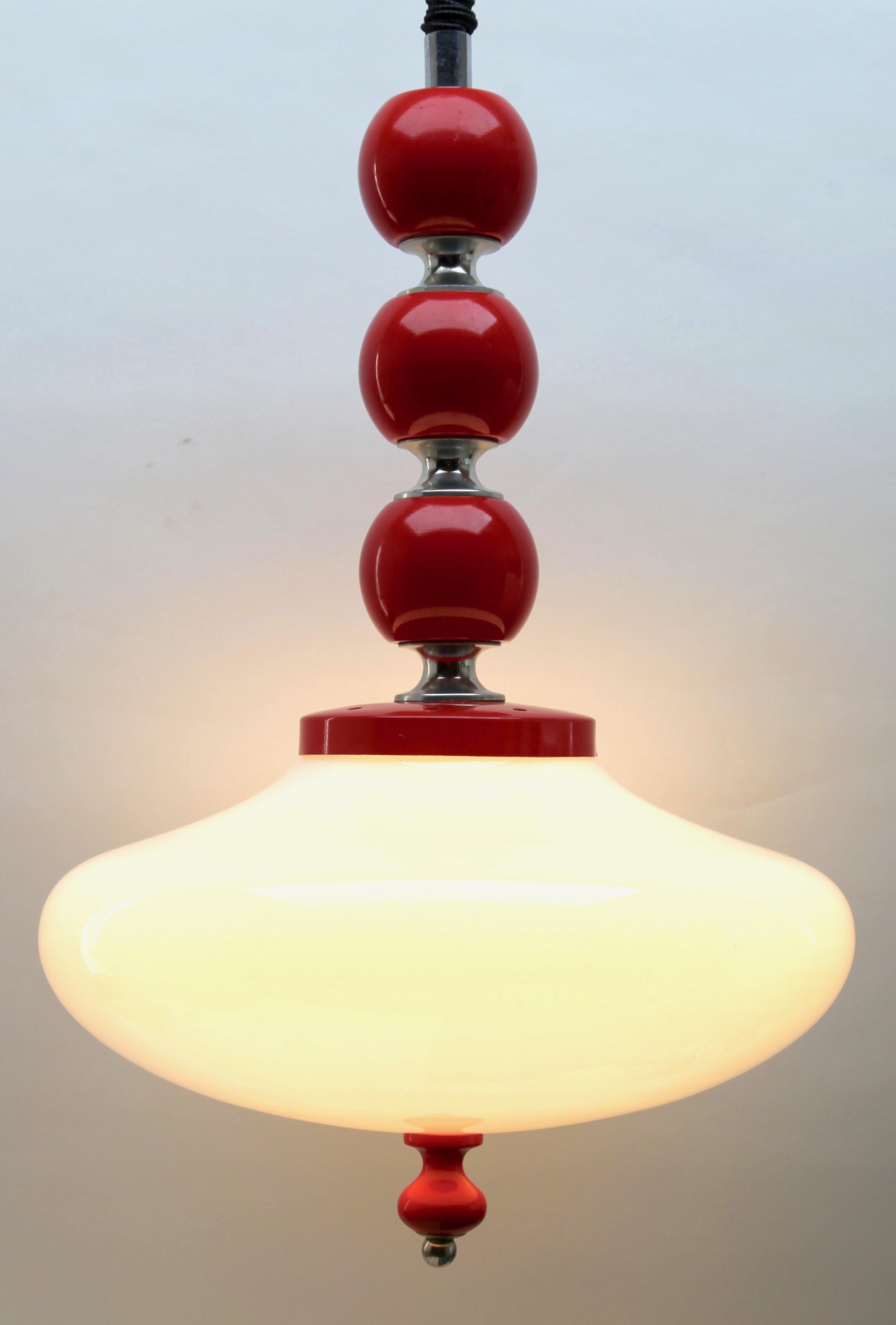 Opaque glass Art Deco pendant ceiling light with glass shade and 2 fittings E14.
This simple 'hanging' shape and reflects a soft light over a wide area.
Adjustable in height by pulling lamp up or down 

In excellent condition and in full working