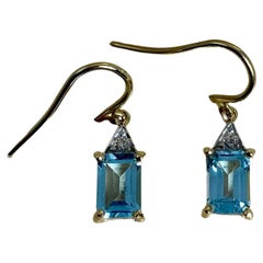 Boucles d'oreilles pendantes vintage avec topas bleu vif stimulant en diamants