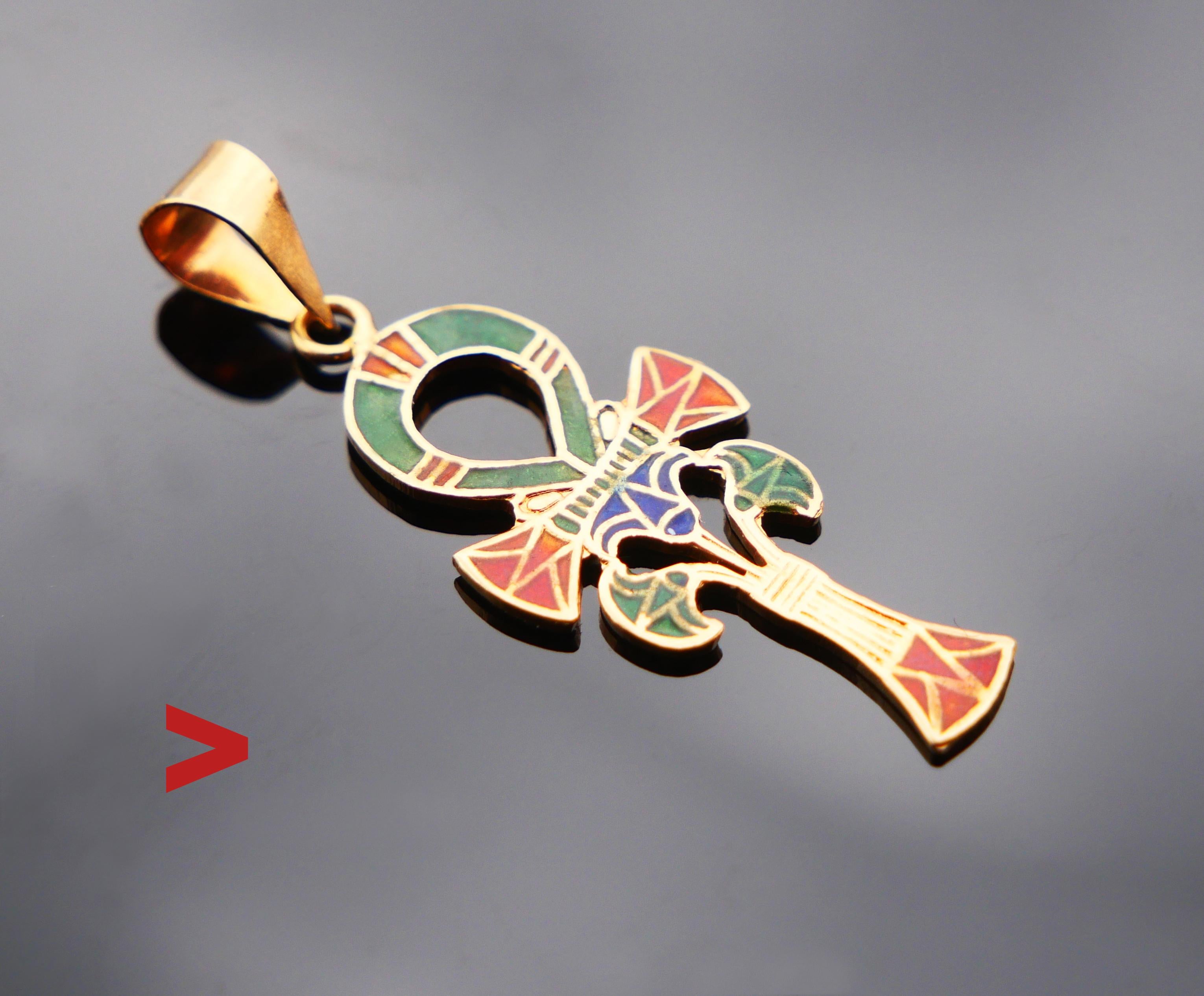 Egyptian handmade Ankh or  ☥ Crux Ansata  pendant in solid 18K Yellow Gold inlaid with Red,Green and Blue Enamels . In fine used condition.

ANKH is a key of life = the vertical line refers to Man’s life, horizontal line means after life will be