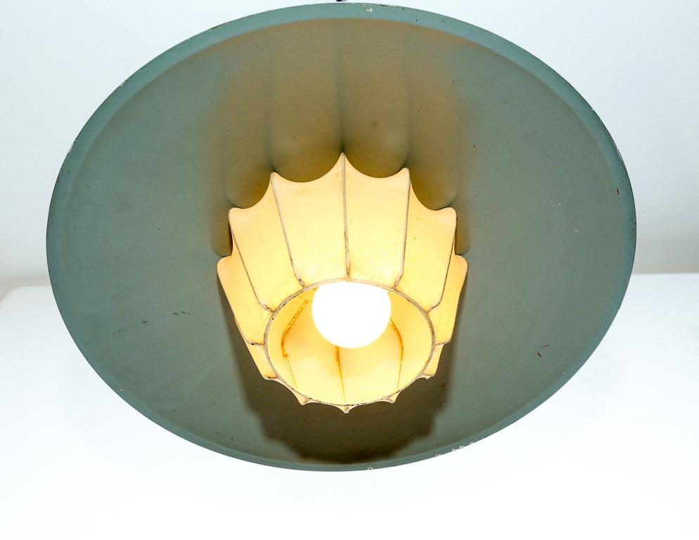 Vintage pendant lamp designed by Louis Kalff for Philips, Holland. Overpainted sage green shade with stretched leather ‘cocoon’ diffuser. Includes original ceiling cap.

This lamp is currently set up for hard-wiring. We offer a service to add custom