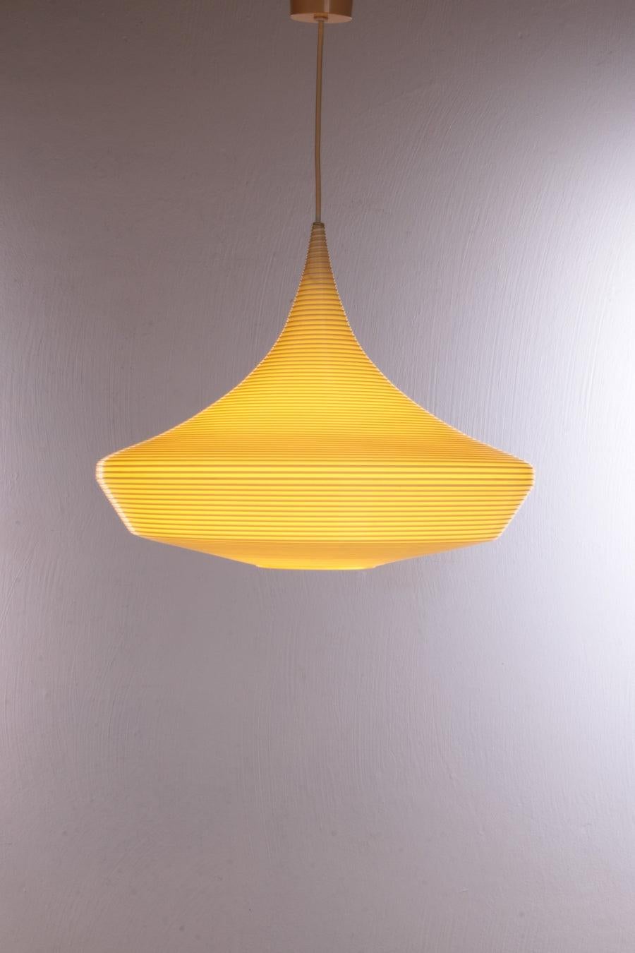 Vintage Pendant Lamp by Yasha Heifetz for Rotaflex Heifetz, 1960s

It is a minimalist hanging lamp made of plastic.

The symmetrical luminaire housing is made of translucent plastic (Rotaflex) and has a grooved structure all around.

Due to its