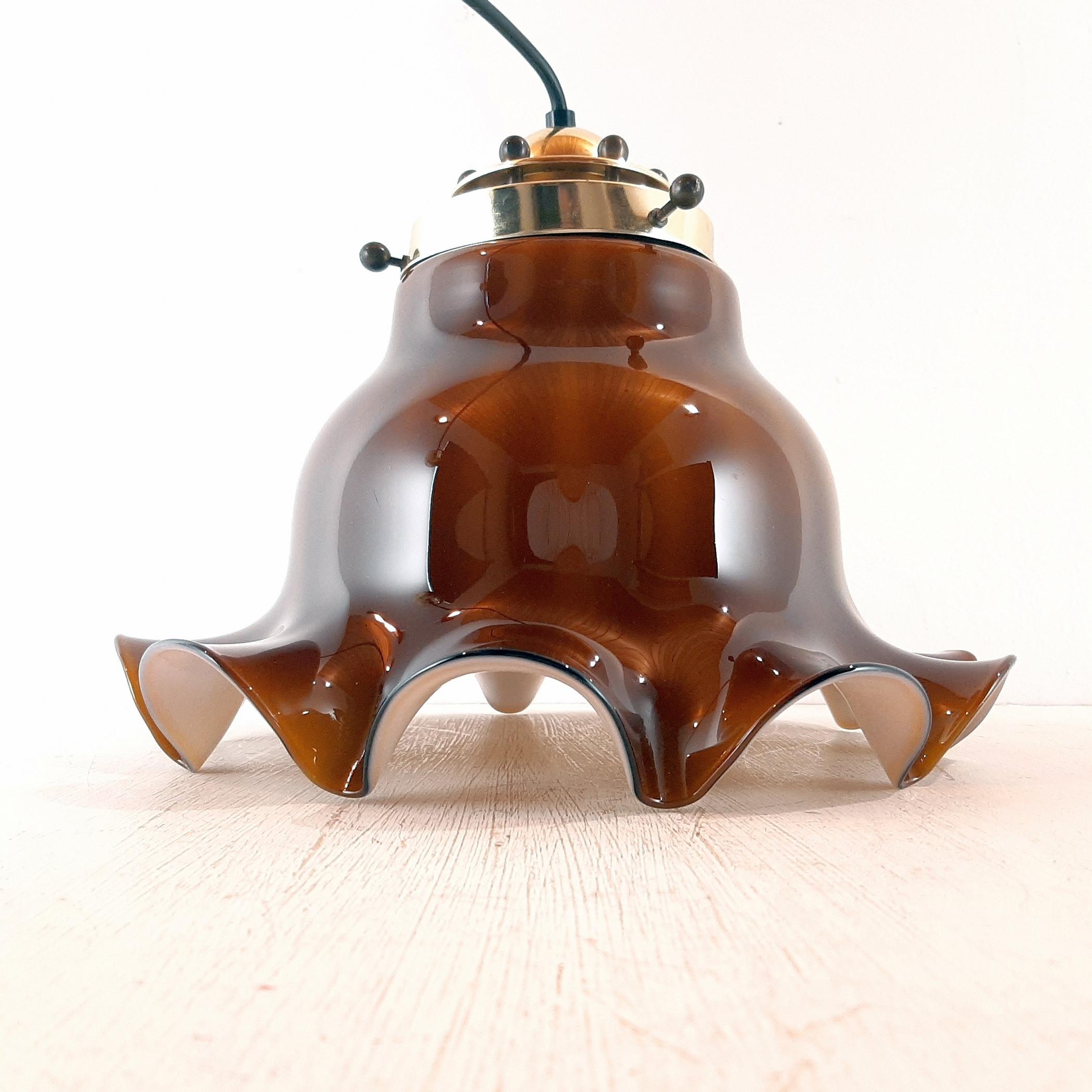 Beautiful 2-Tone brown pendant lamp Petticoat by Peill & Putzler made in Düren (Germany) in the 1970s.
Peill und Sohn was founded in 1903 in Düren, a small town in Western Germany. In 1947, it merged with Putzler, a glass and lighting company