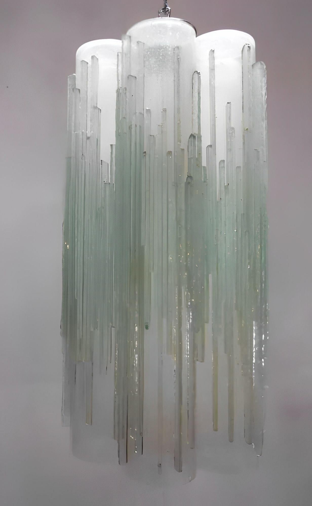 Striking vintage Italian pendant light featuring clear frosted Murano glass tubes, hand-blown with a distinctive icicle-like texture. The substantial glass elements are elegantly suspended from polished chrome hardware, creating a dramatic interplay