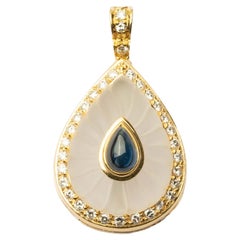 Vintage pendant with cabochon sapphire and diamonds Vintage pendant with cabochon sapphire and diamonds