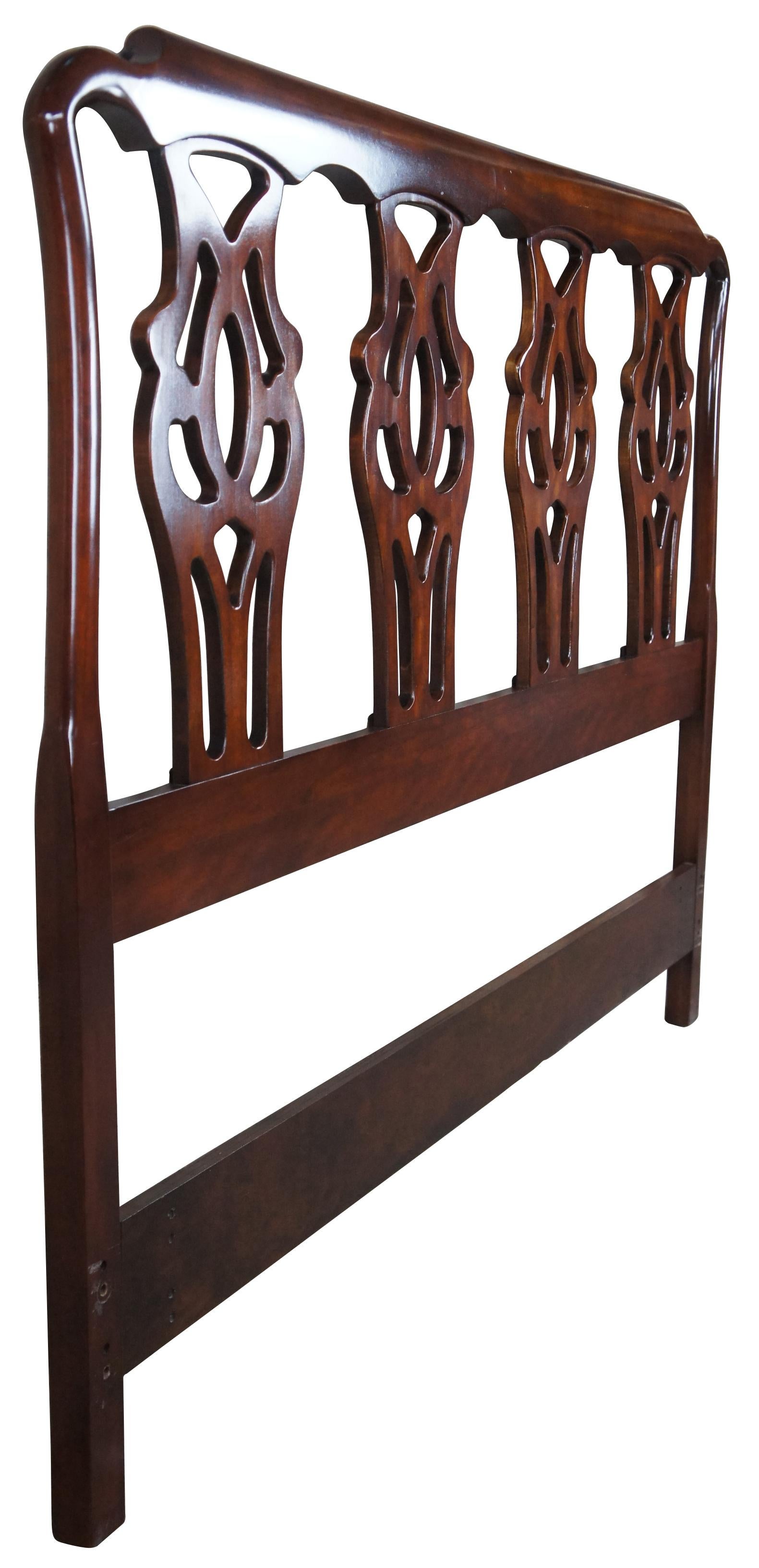 Circa 1960s Chippendale headboard by Pennsylvania House. Made from Cherry with an interlaced splat back.
 