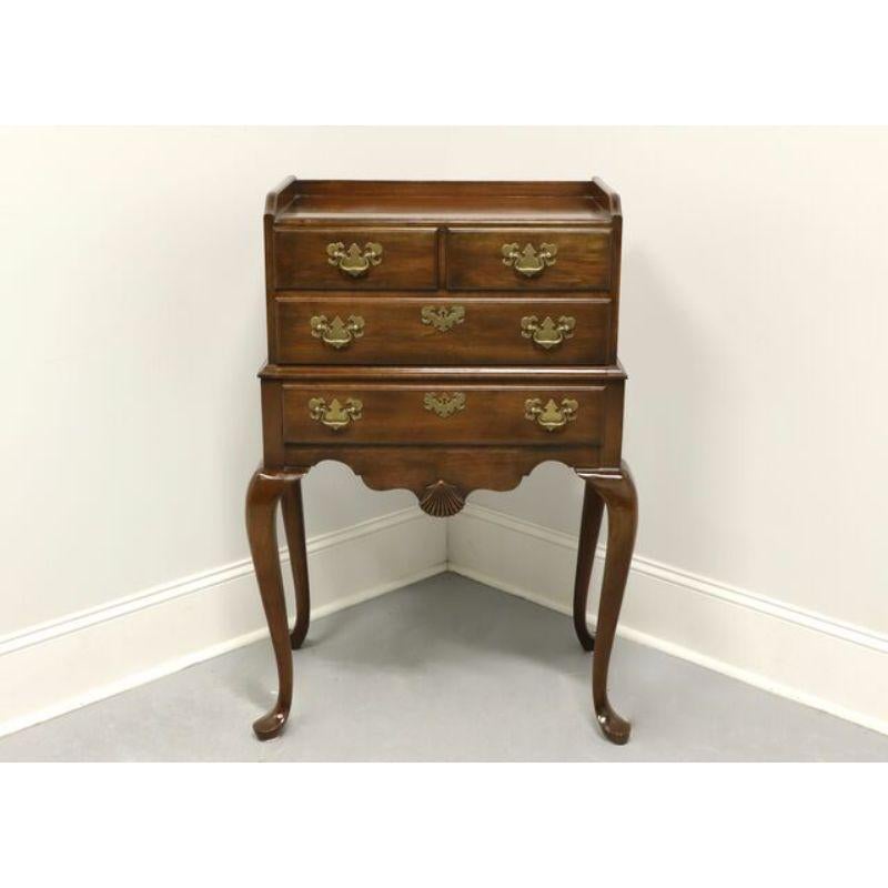 A Queen Anne style silver chest by Pennsylvania House. Solid cherry with brass hardware, side handles, cabriole legs and pad feet. Features chest of two smaller divided felt lined dovetailed drawers over two larger felt lined dovetailed drawers with
