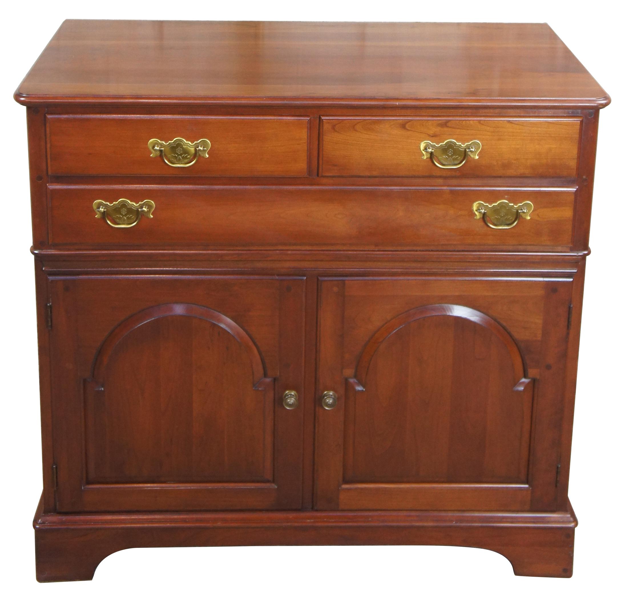 Vintage Pennsylvania House solid cherry traditional buffet server sideboard

Pennsylvania House 10-5538 cherry buffet or server, circa 1960s. Includes three drawers, lower cabinet with shelf and engraved brass hardware.
   