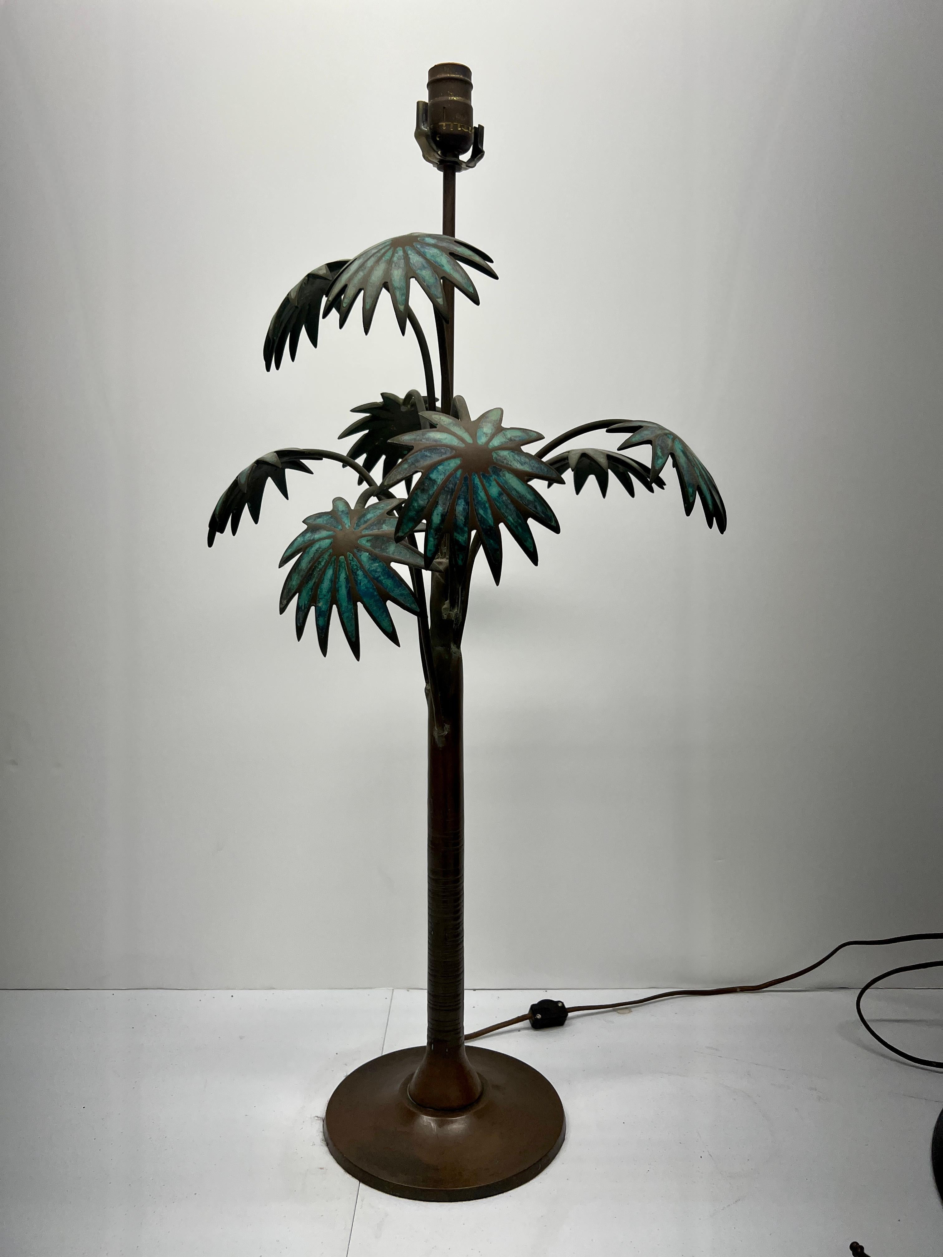 Exceptional, heavy & quality bronze table lamp by Pepe Mendoza. The table lamp features a bronze stem and round base, palm fronds inset with malachite across each leaf. Brass fittings, original vintage cord (in working condition but we would suggest