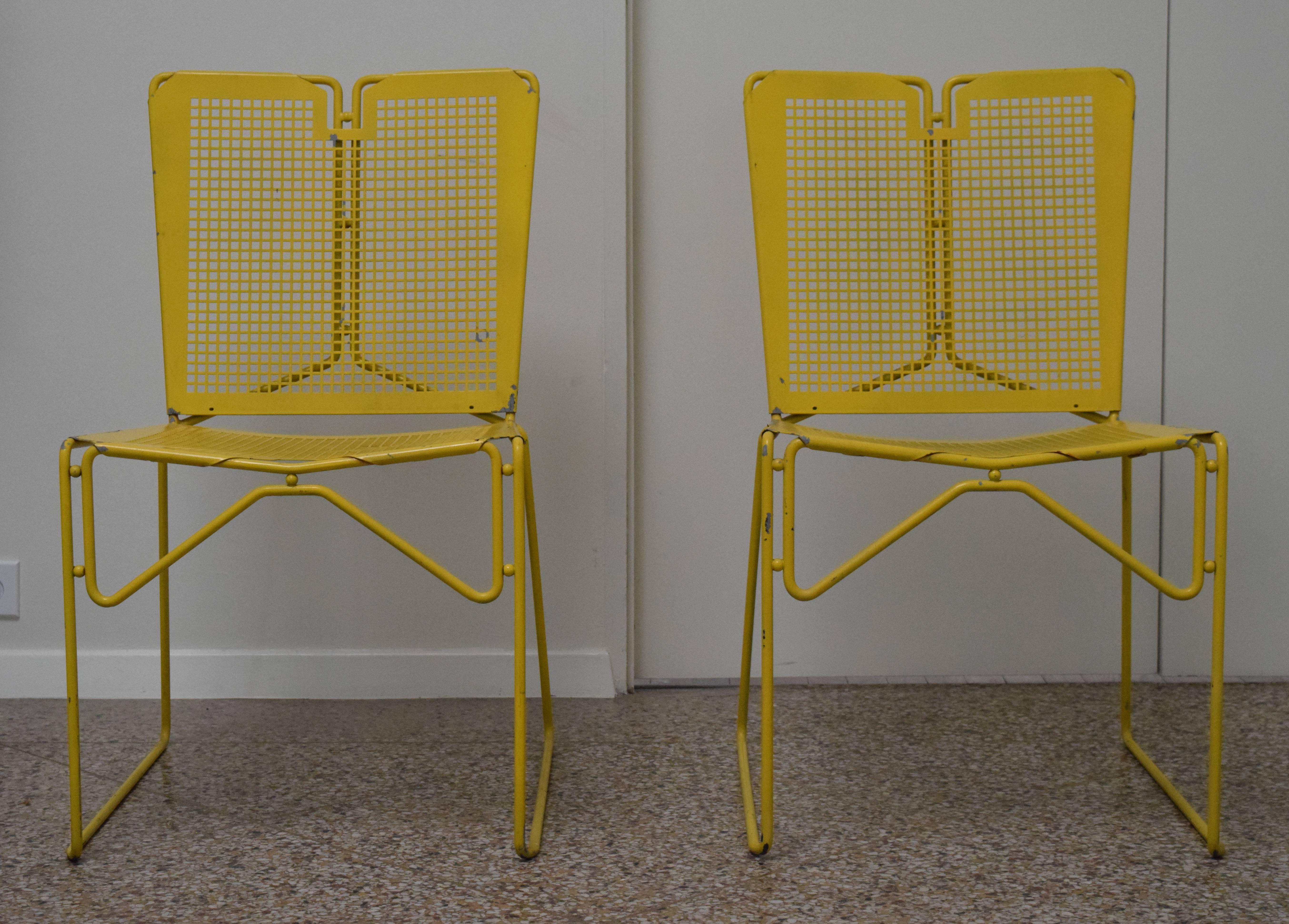 Style of Mathieu Matégot chairs in gridded perforated metal.