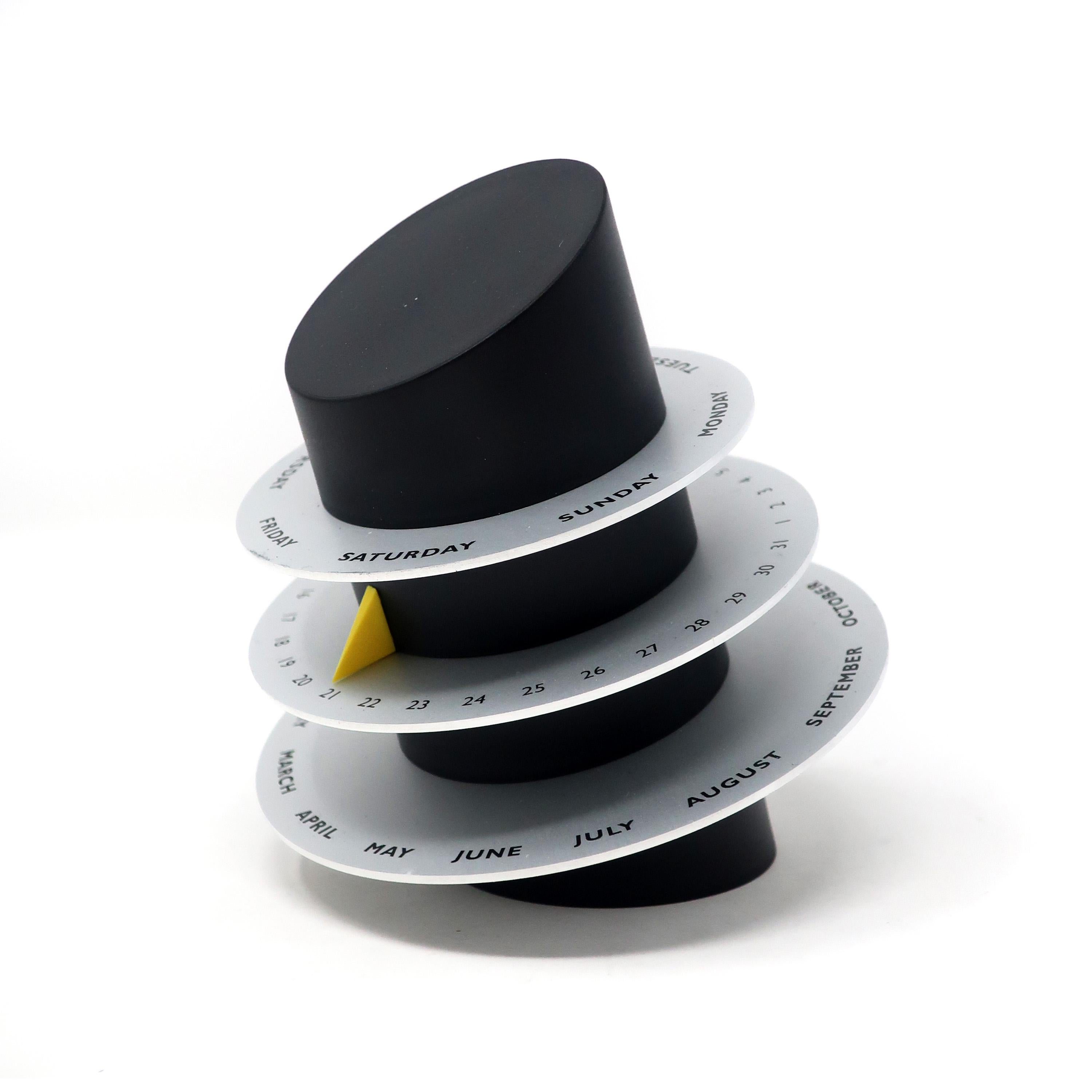 An amazing Scandinavian Modern perpetual desk calendar designed by Mette Kiellerup for Royal Copenhagen with three adjustable metal wheels to display the day, date and month. Marked Royal Copenhagen on bottom wheel and remains in its original