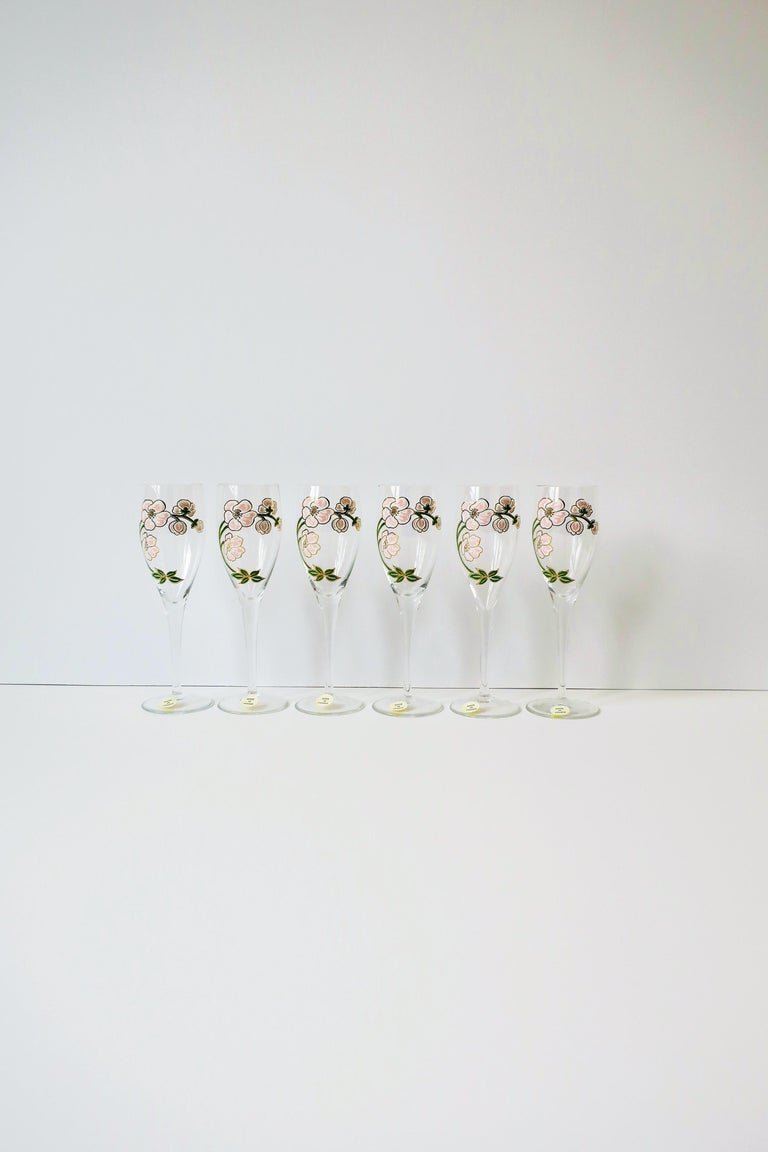 A beautiful set of six (6) vintage Perrier-Jouet French champagne flute glasses with iconic floral motif in the Art Nouveau style, circa mid to late-20th century, France. All six flutes are marked 