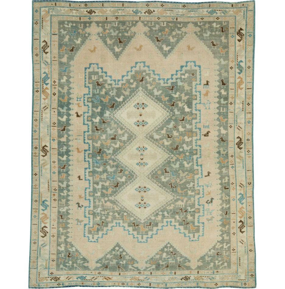A vintage Persian tribal accent rug handmade by the nomadic Afshar tribes during the mid-20th century.

Measures: 4' 7