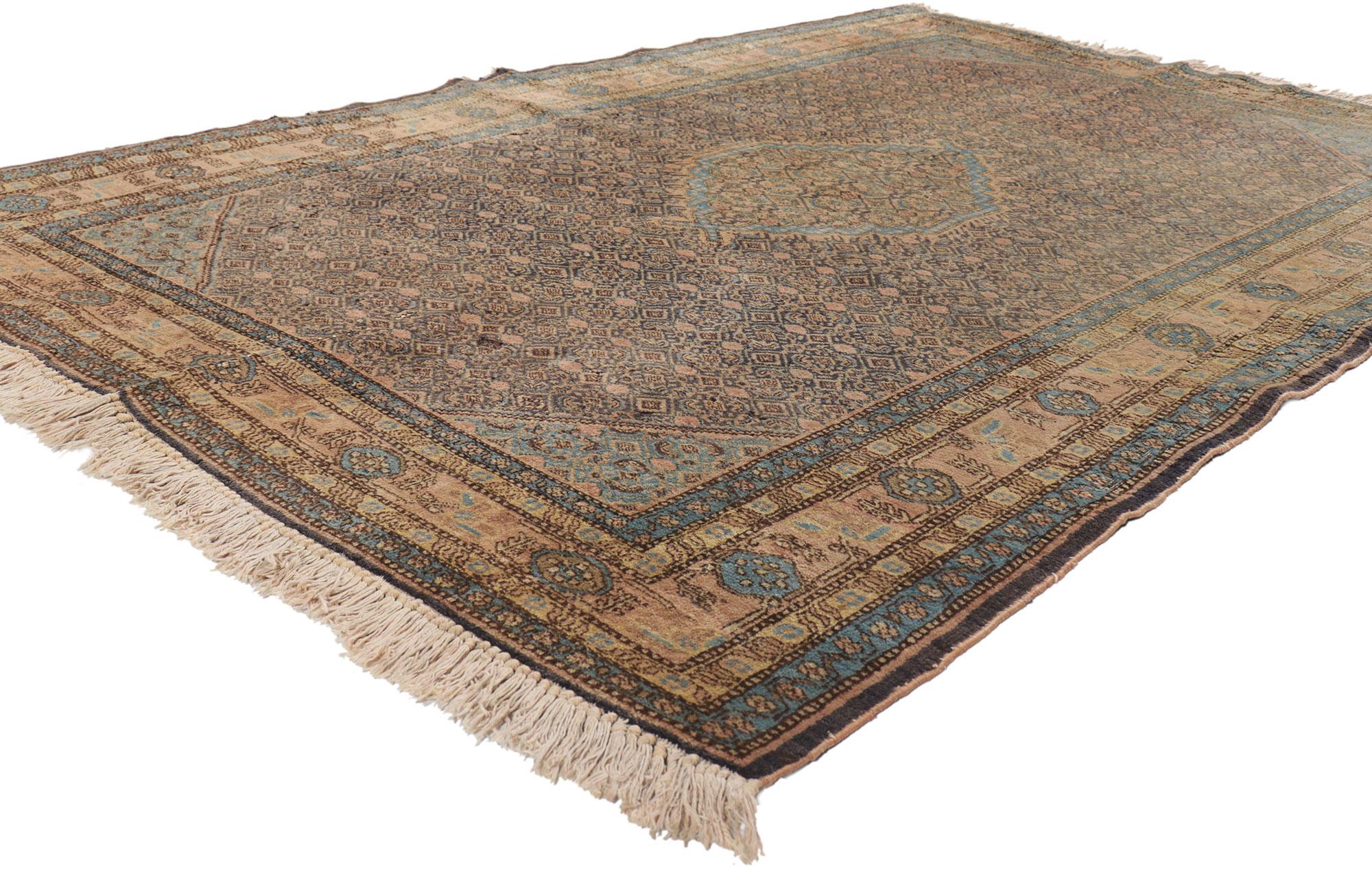 21682 Vintage Persian Ardabil rug 04'07 x 06'05.
Emanating timeless style with incredible detail and texture, this hand knotted wool vintage Persian Ardabil rug is a captivating vision of woven beauty. The eye-catching Herati design and