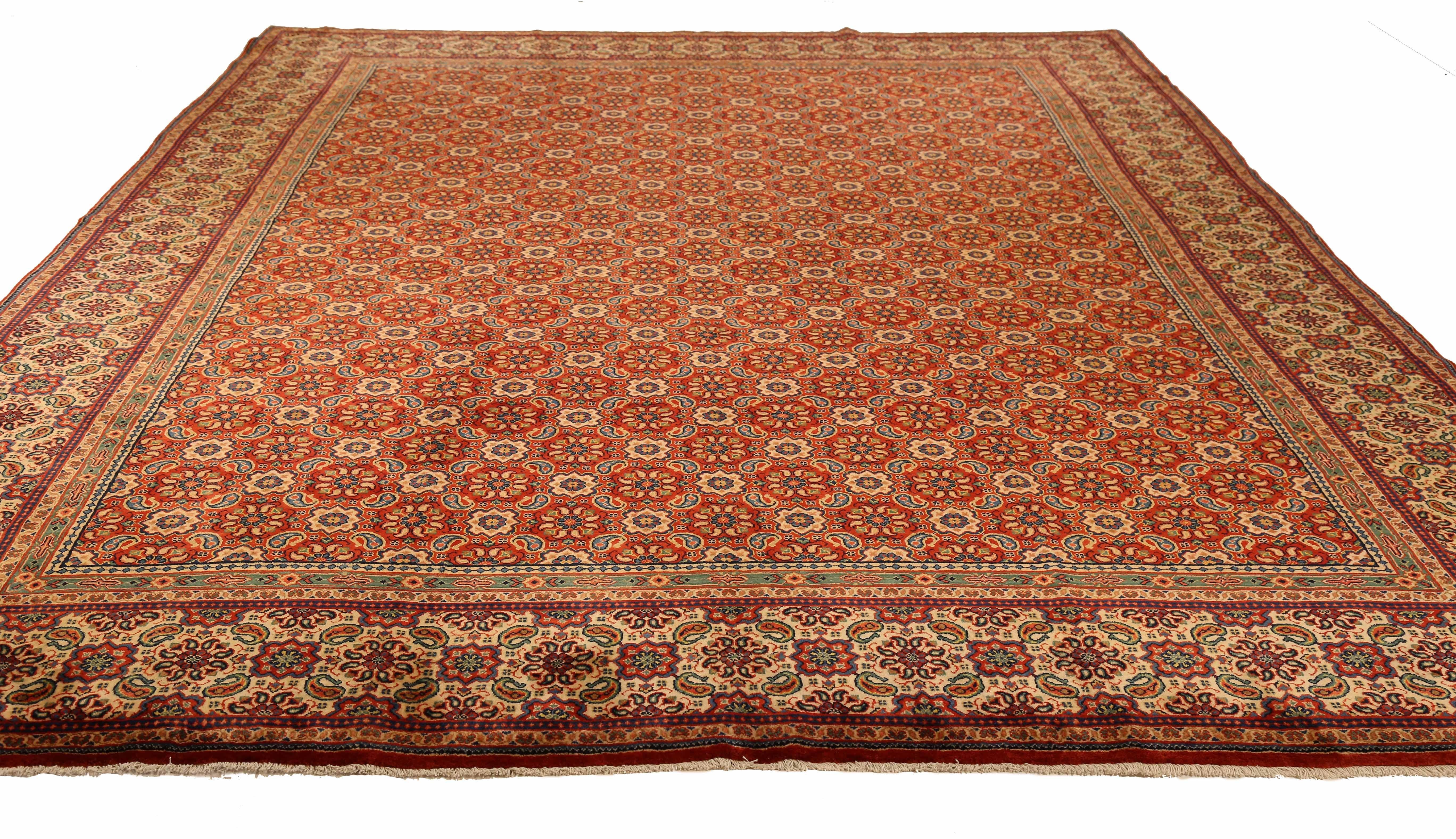 This stunning vintage Persian area rug boasts a rich tradition, handwoven by skilled artisans using the finest sheep's wool and all-natural vegetable dyes, ensuring its safety for both humans and pets. The rug features a classic Sarouk design,