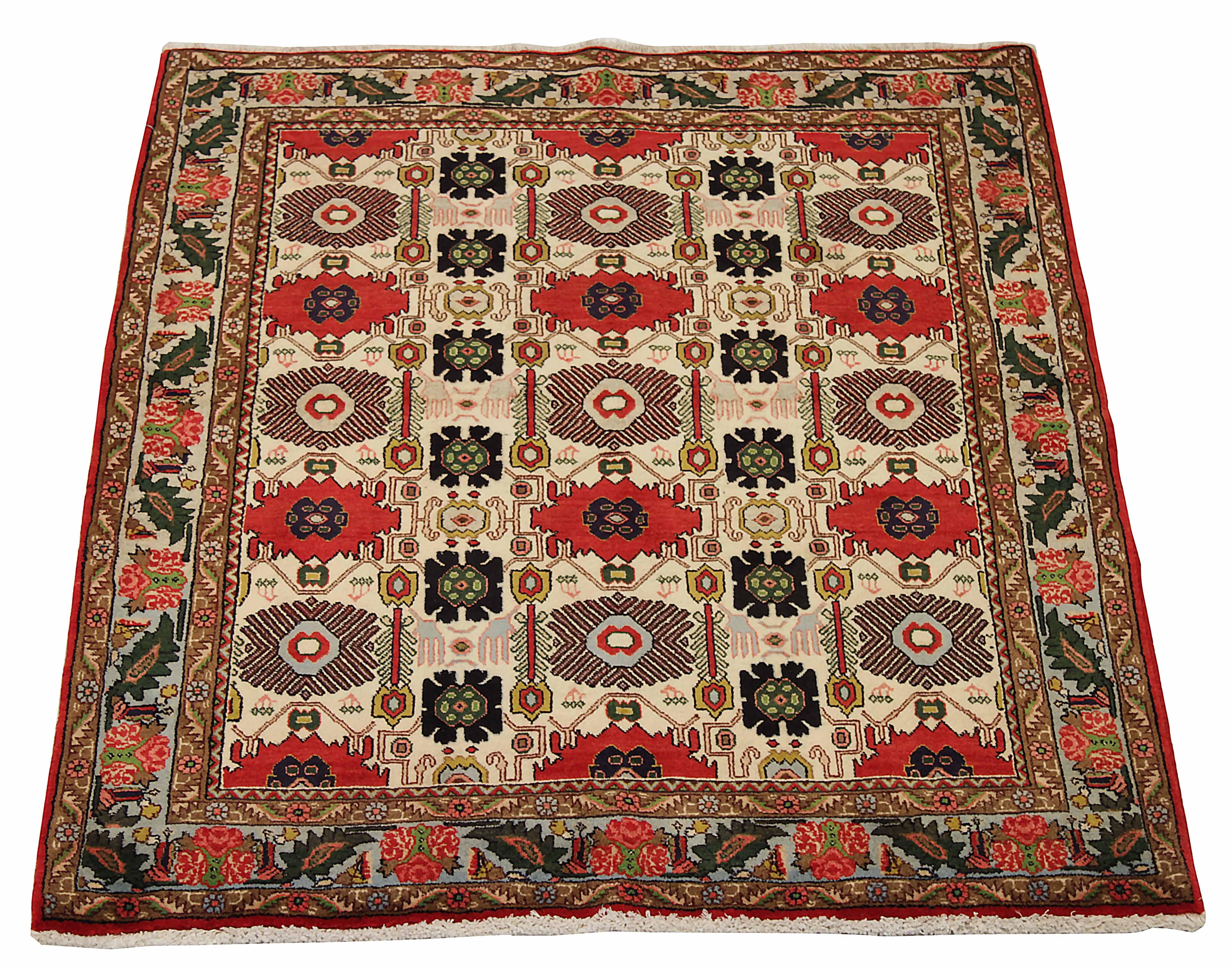 This vintage Persian area rug is an exquisite handwoven piece made from the finest sheep's wool and colored using only safe, all-natural vegetable dyes. Featuring a classic Sarouk design, expert artisans have crafted this beautiful rug with skill