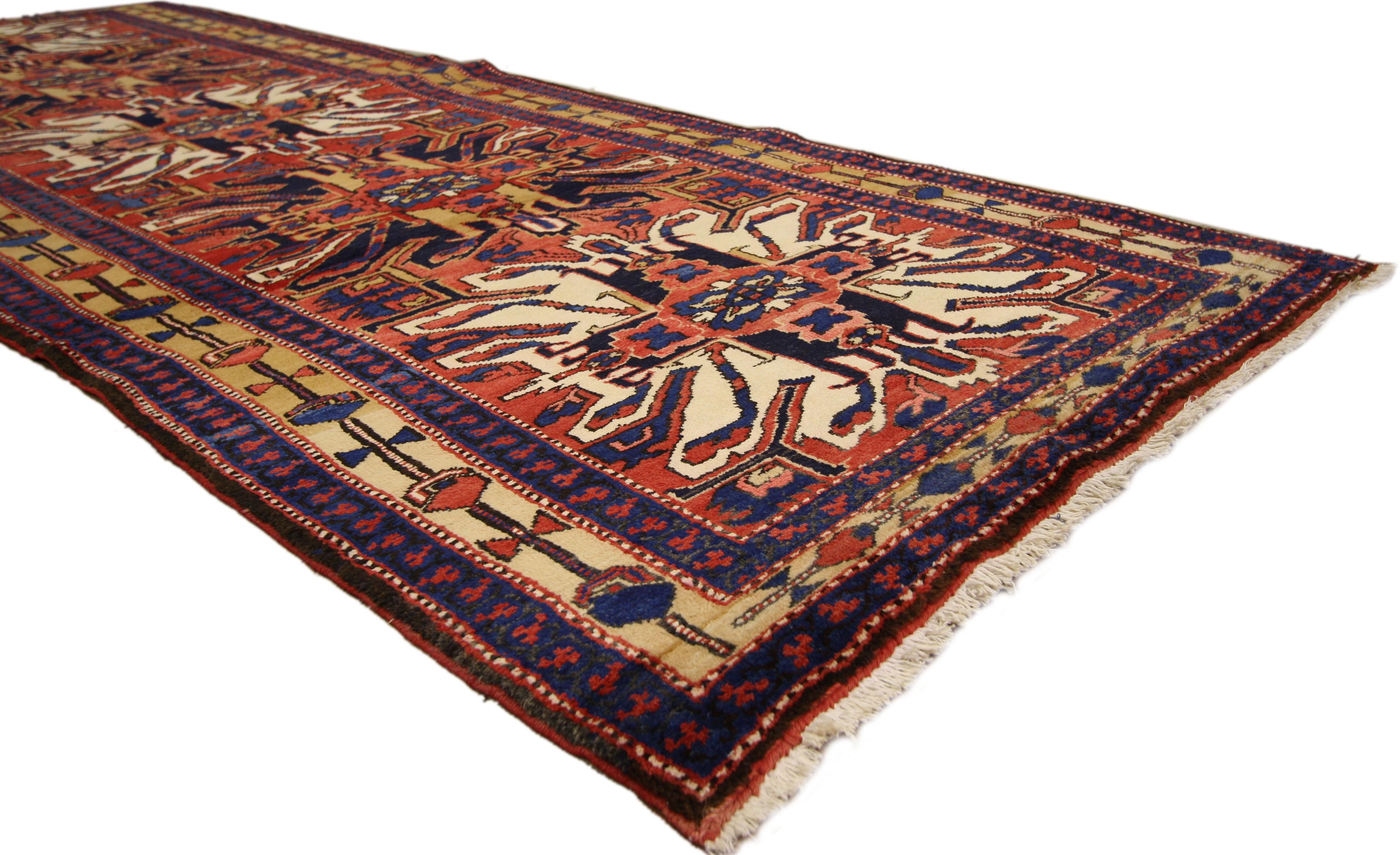 ​75377 Vintage Persian Azerbaijan Runner, Tribal Style Hallway Azari Runner 03'09 x 10'03. This hand-knotted wool vintage Persian Azari runner with abstract tribal style features five embellished amulet medallions in an abrashed ruby red field. It