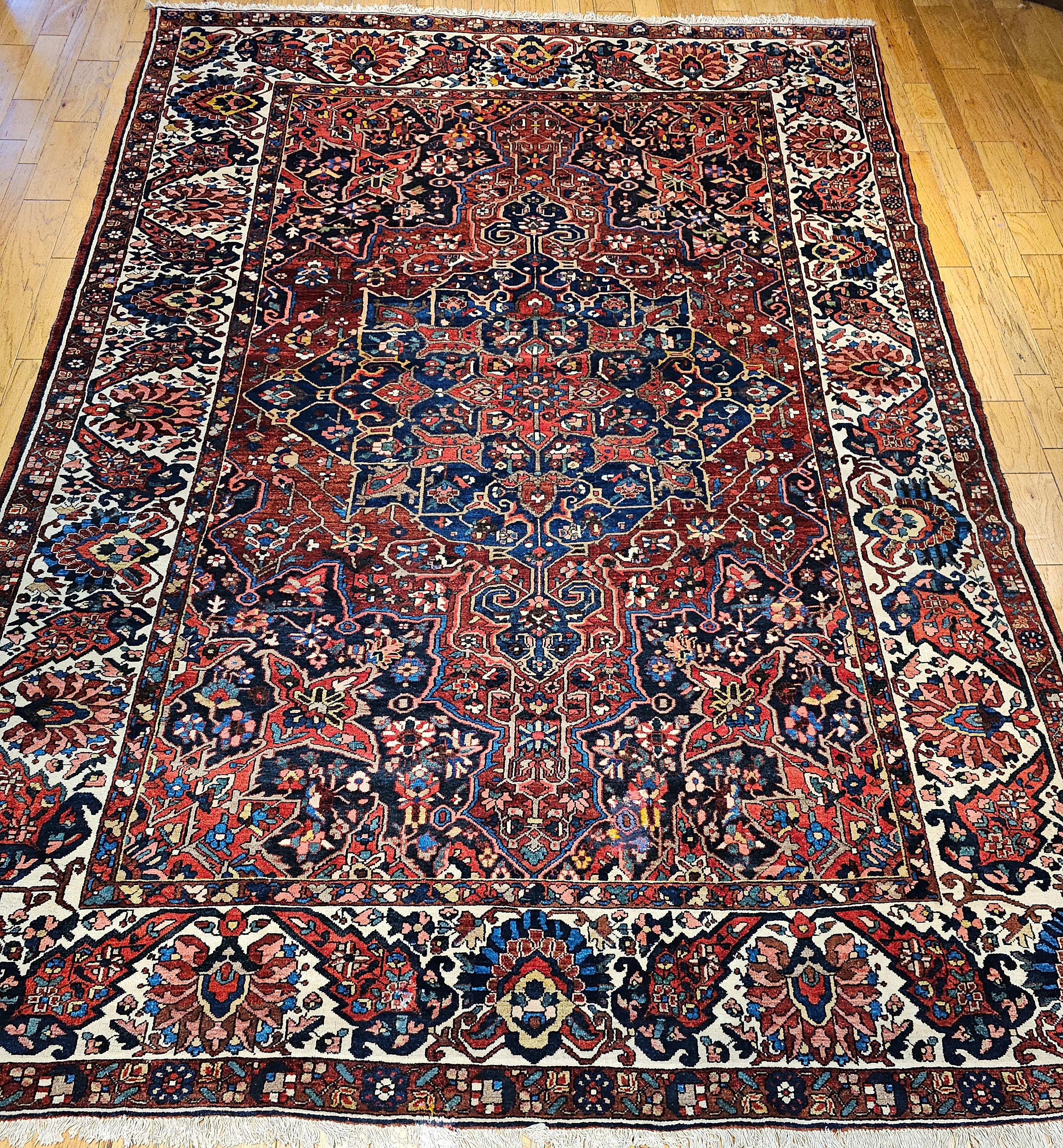  A rare oversize Persian Bakhtiari in a geometric pattern.  The rug design resembles the Persian Heriz Serapi geometric rugs from NW Persia and makes this a very desirable Bakhtiari.    The rug has a dark red/burgundy background color with center