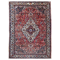 Tapis persan Bakhtiari vintage à motif floral médaillon rouge brique
