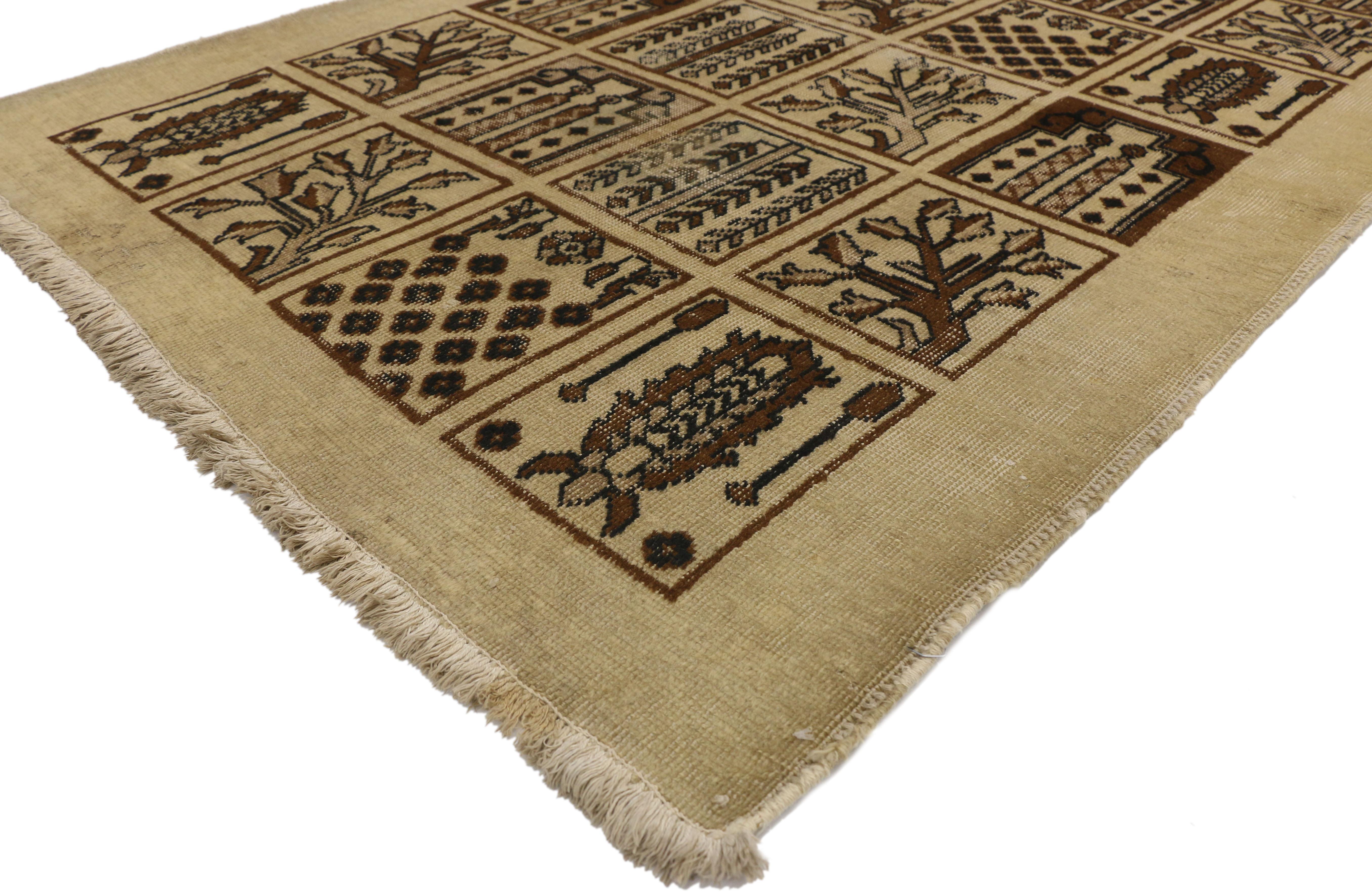 73299, distressed vintage Persian Bakhtiari rug with garden design and Black Forest style. A beautiful, unique garden design is on display in this distressed vintage Bakhtiari Persian rug. Each individual square compartment is 